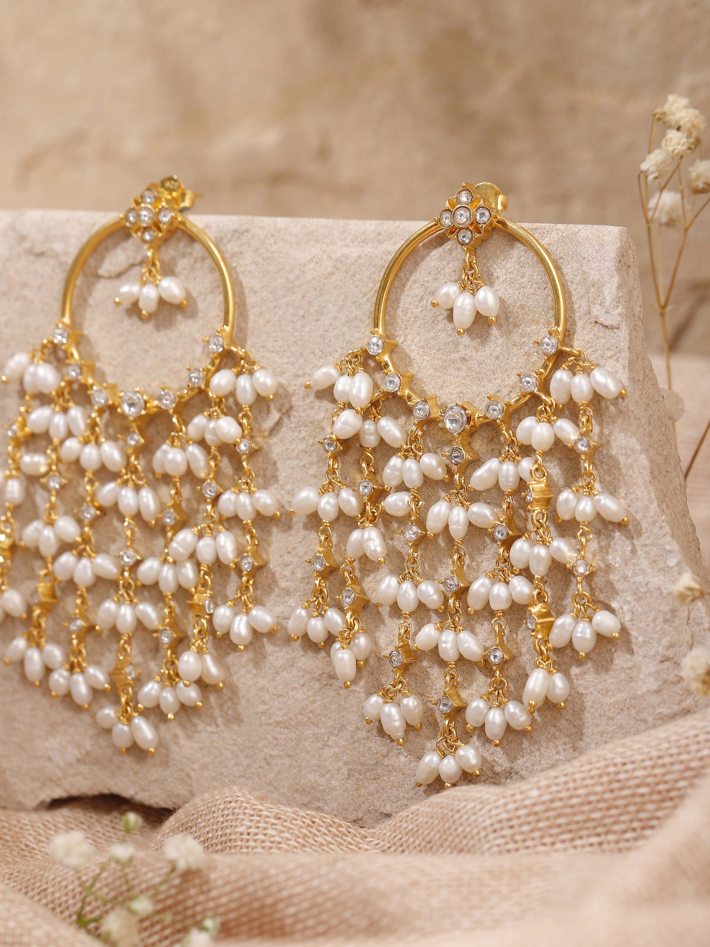 Alternate lifestyle view highlighting how the earrings complement traditional outfits with rich textures.