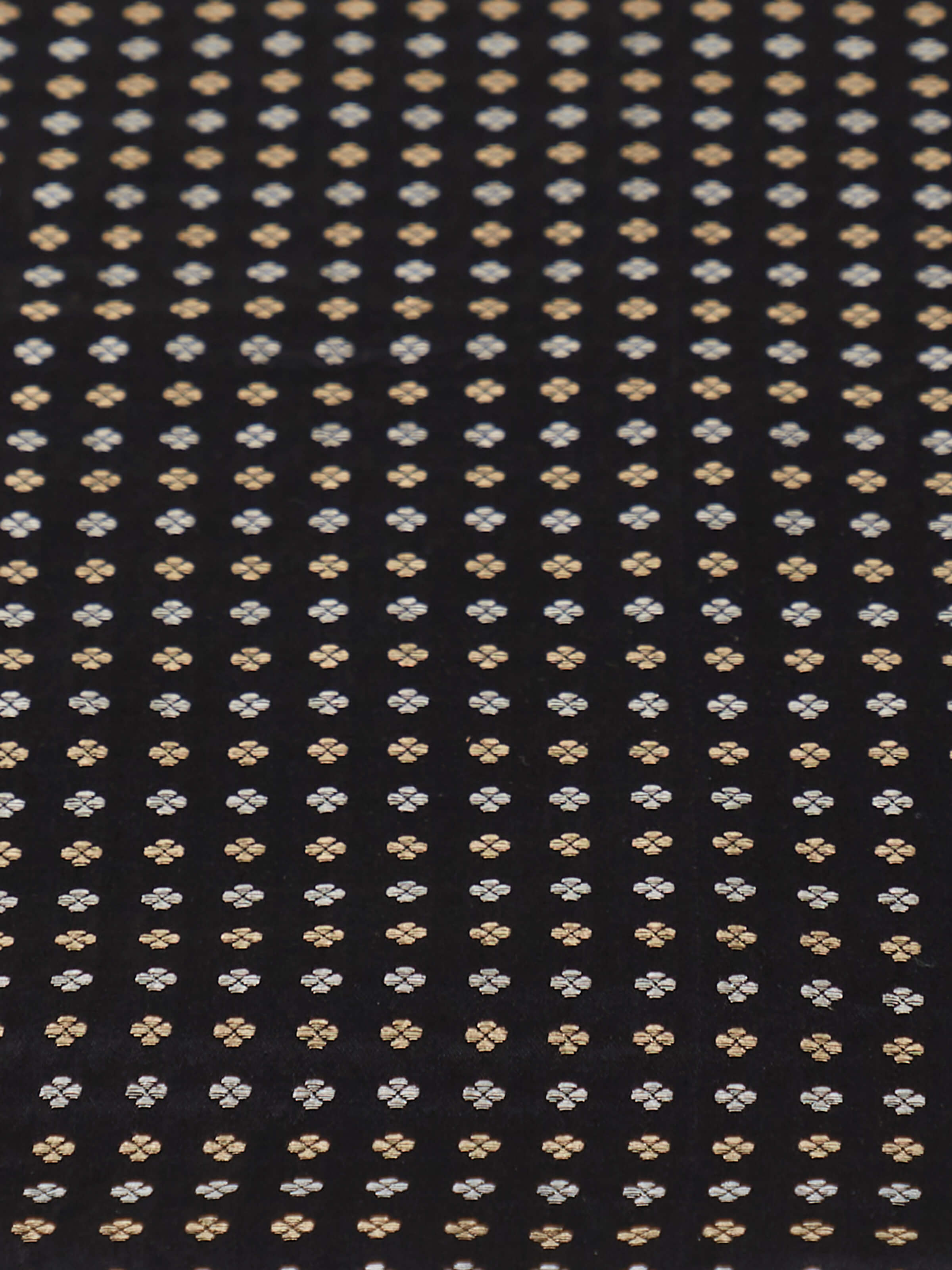 Detail shot highlighting intricate brocade weave and rich silk craftsmanship.