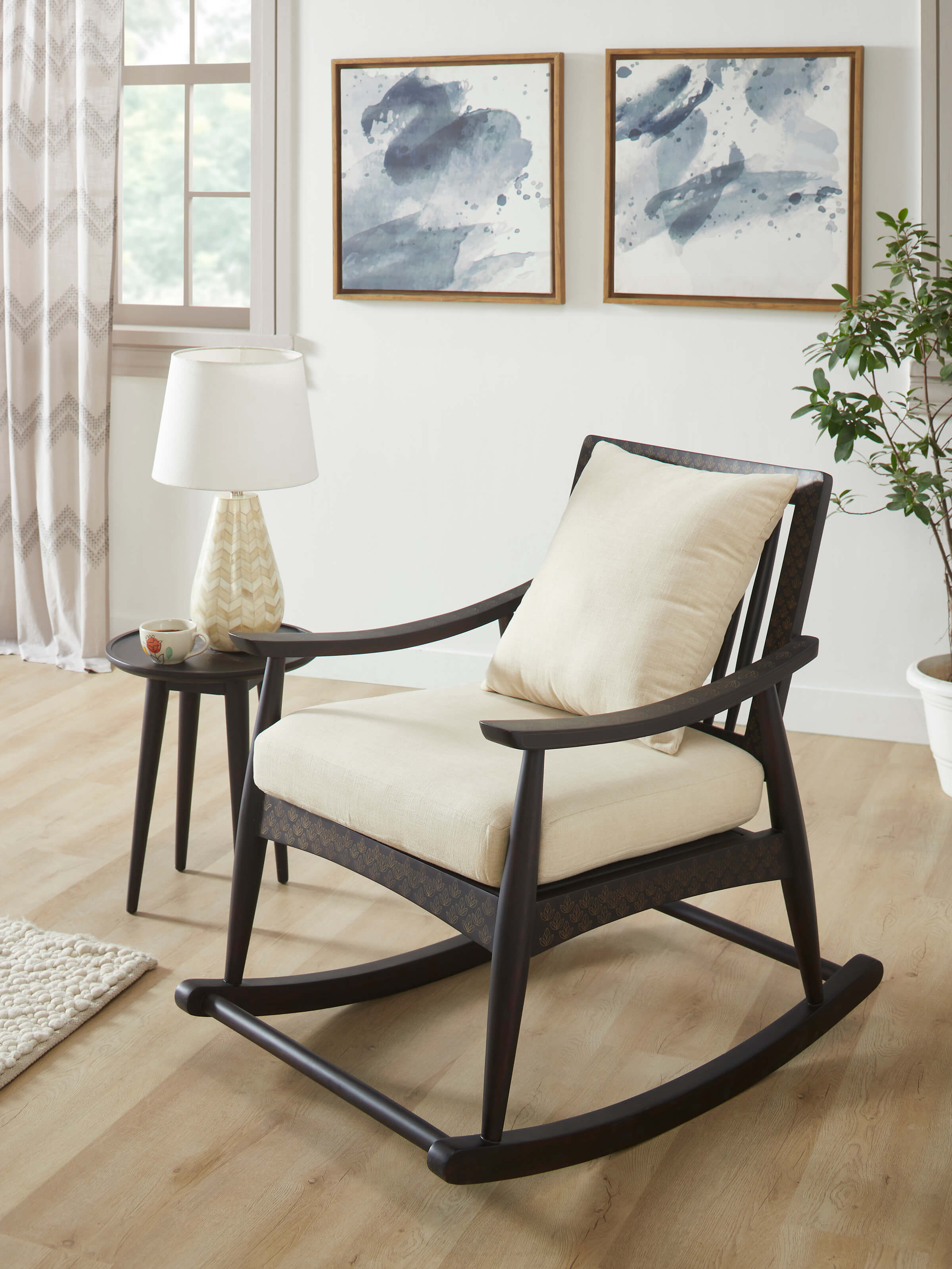 Side view of the Sheesham wood and brass tarkashi rocking chair, highlighting its elegant profile and detailed brass inlay work.