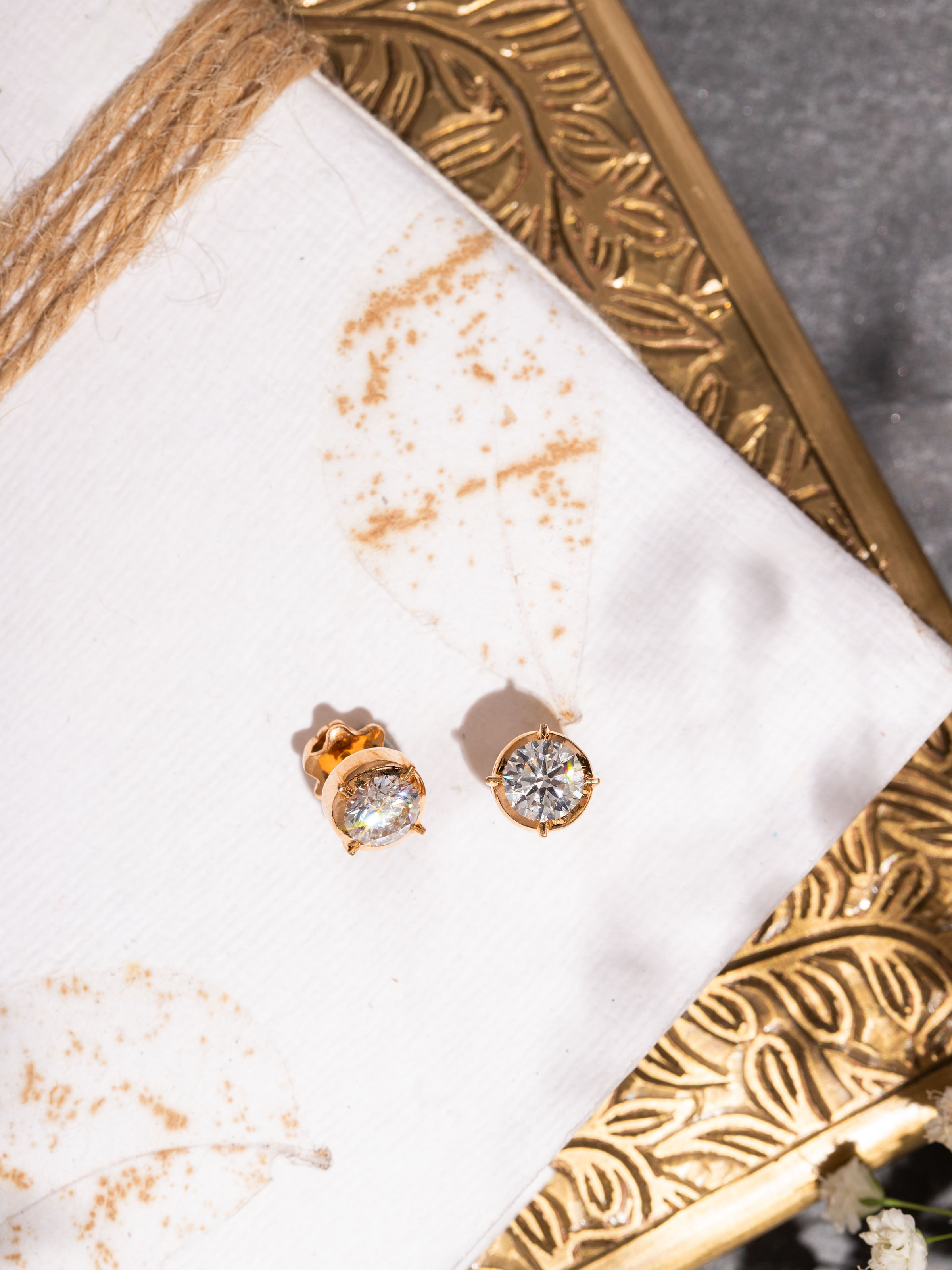 Side view of Swadesh Close-setting 22 Karat Gold Studs highlighting intricate detailing and polished finish