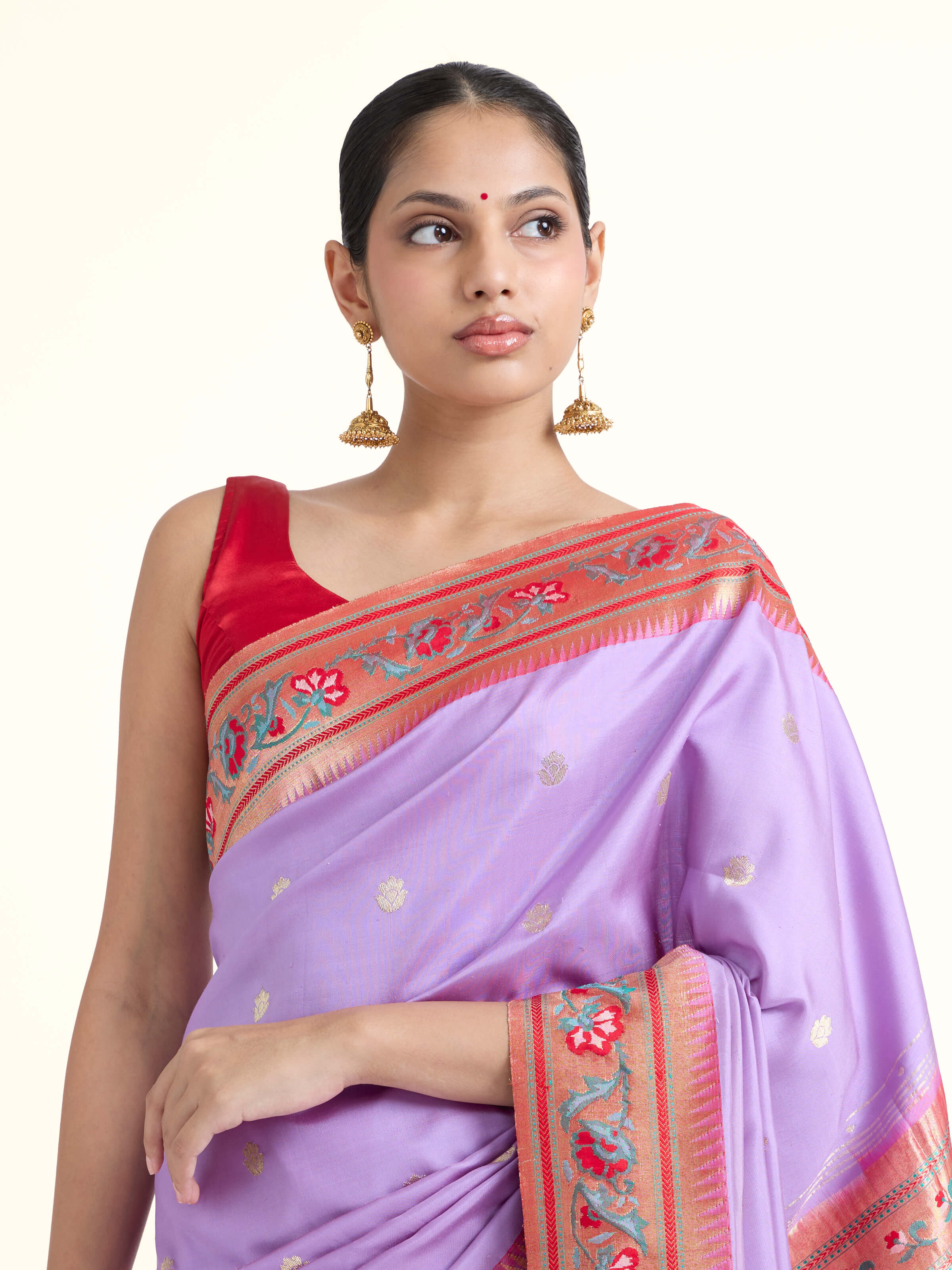 Angled view of Babitha silk Paithani saree highlighting rich zari pallu