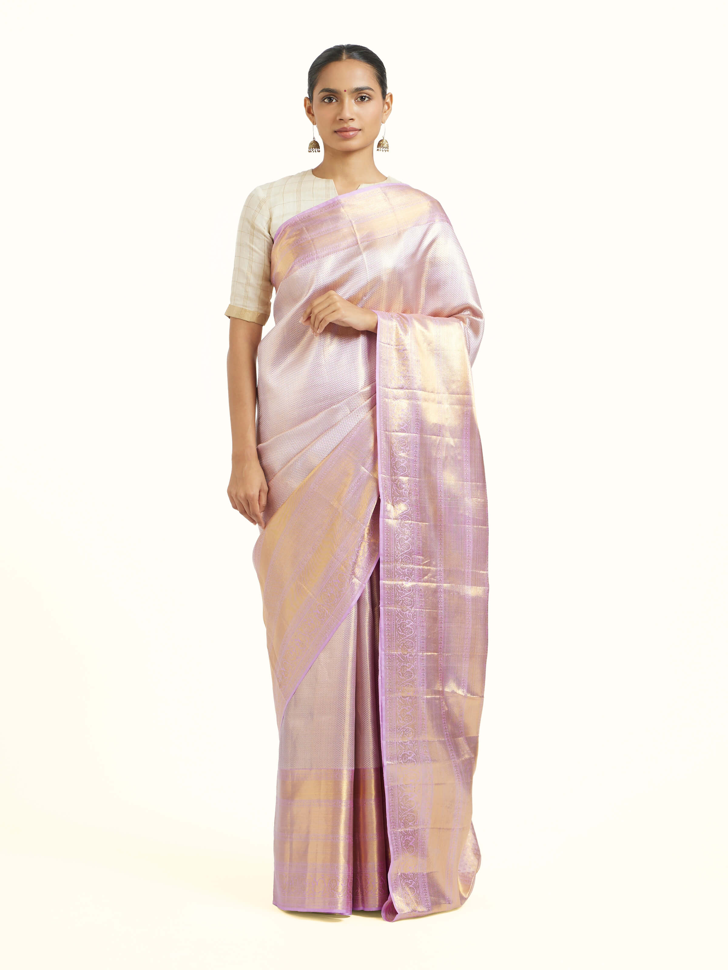 Front view of beige silk Kancheepuram saree with elegant zari motifs