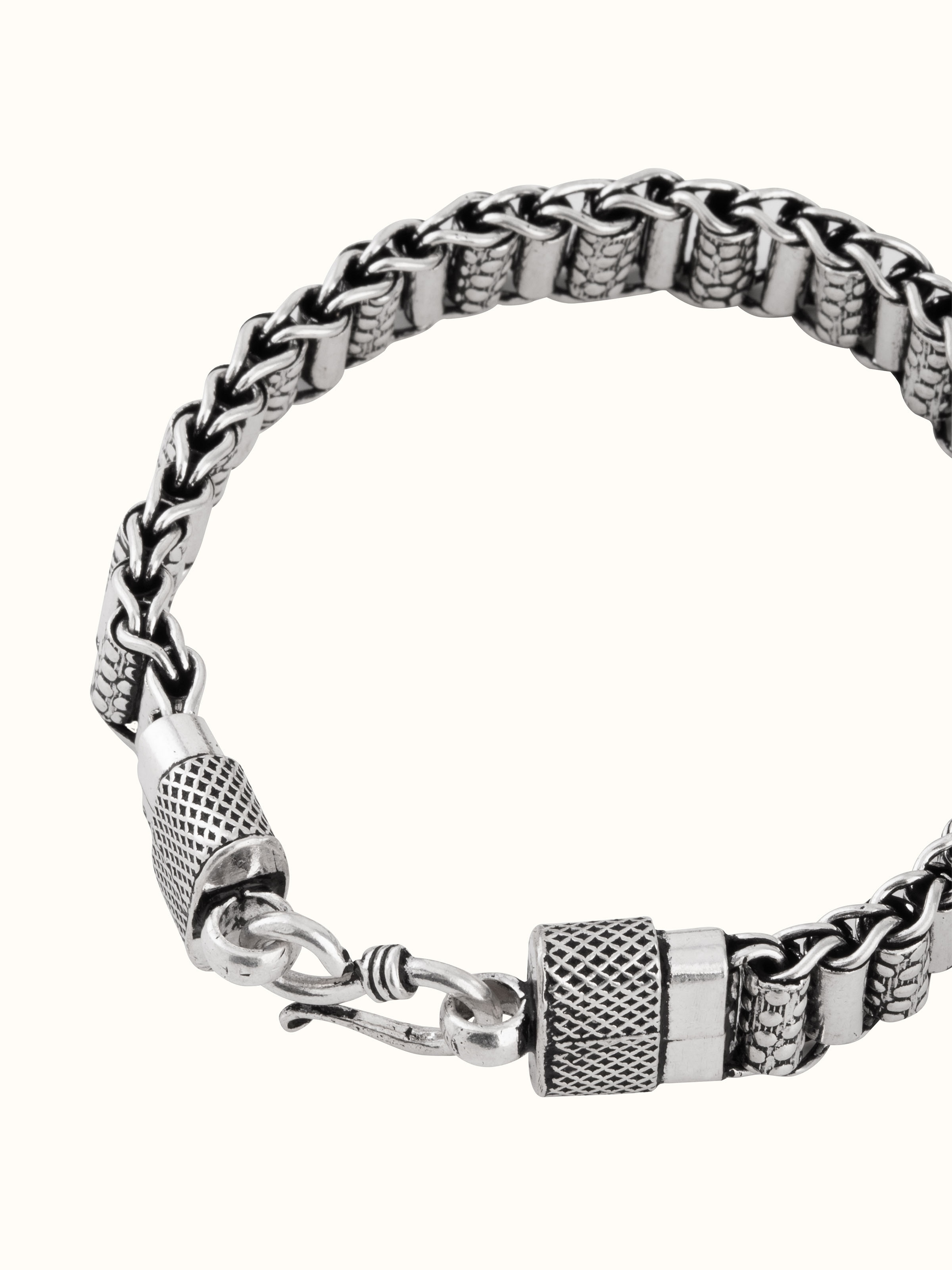 Overhead flat-lay view of full bracelet design with interlinked form.