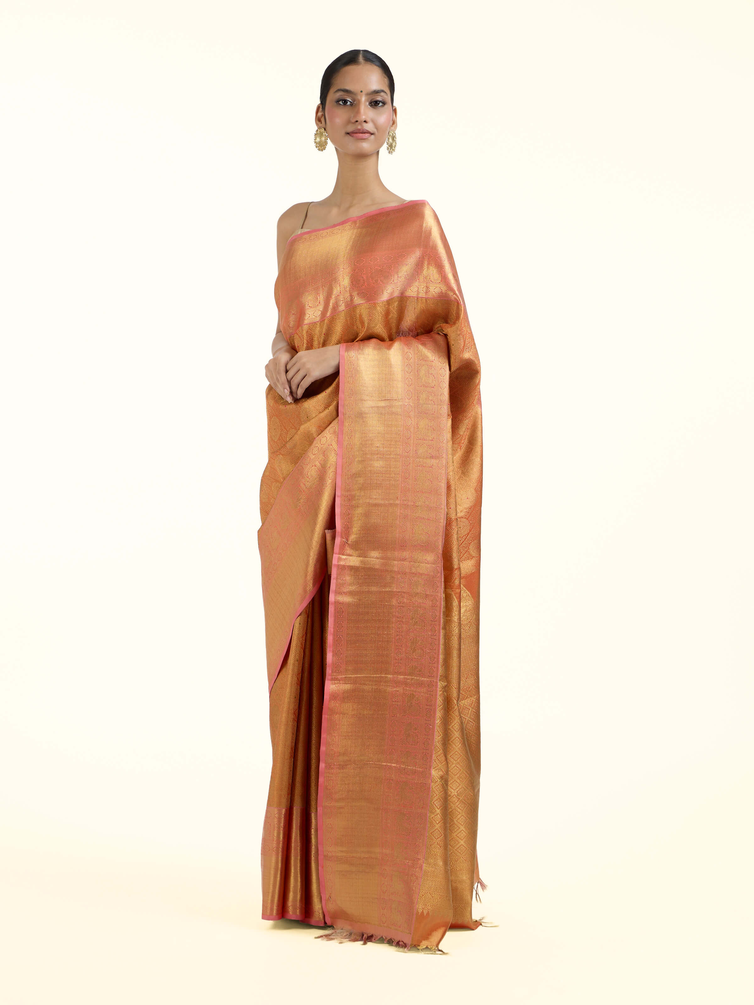 Side view of yellow silk Kancheepuram saree with graceful drape and contrast border