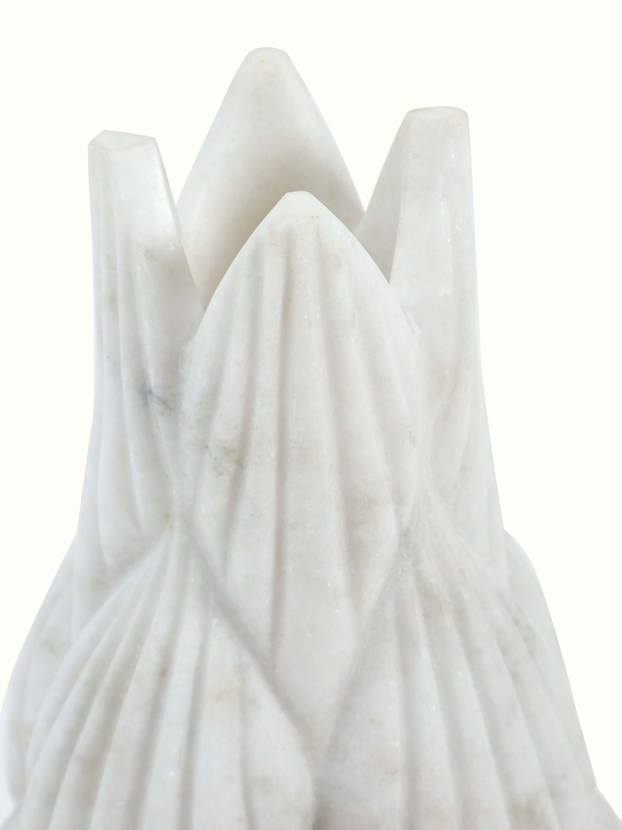 Detail close-up of marble carving floor vase showing carved motifs