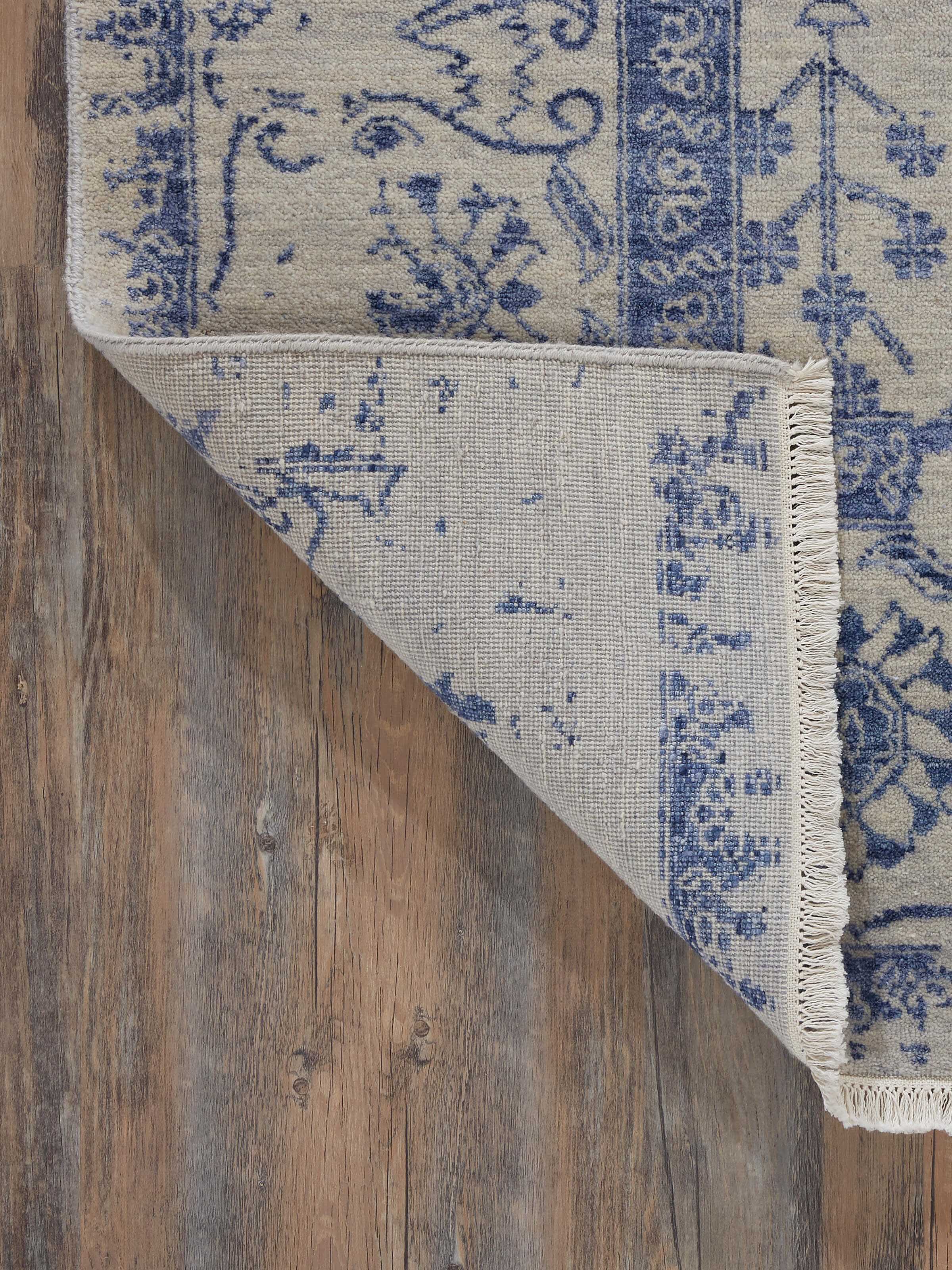 Full view of Distressed Transitional Grey Blue Agra wool & viscose hand-knotted rug spread out to show its design and size