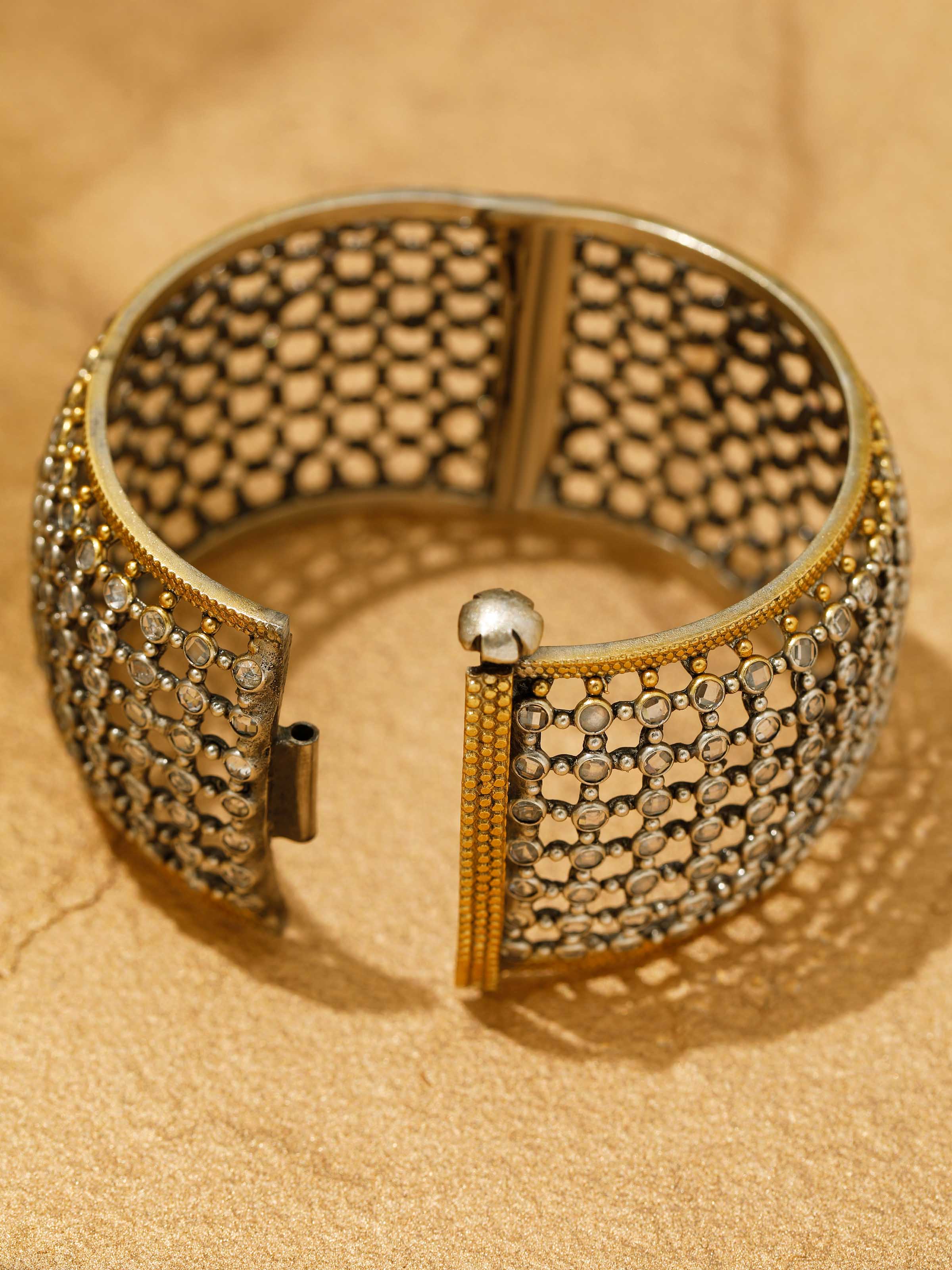 Detailed side view of Silver Smithing bangle highlighting the hammered finish and open-ended design.