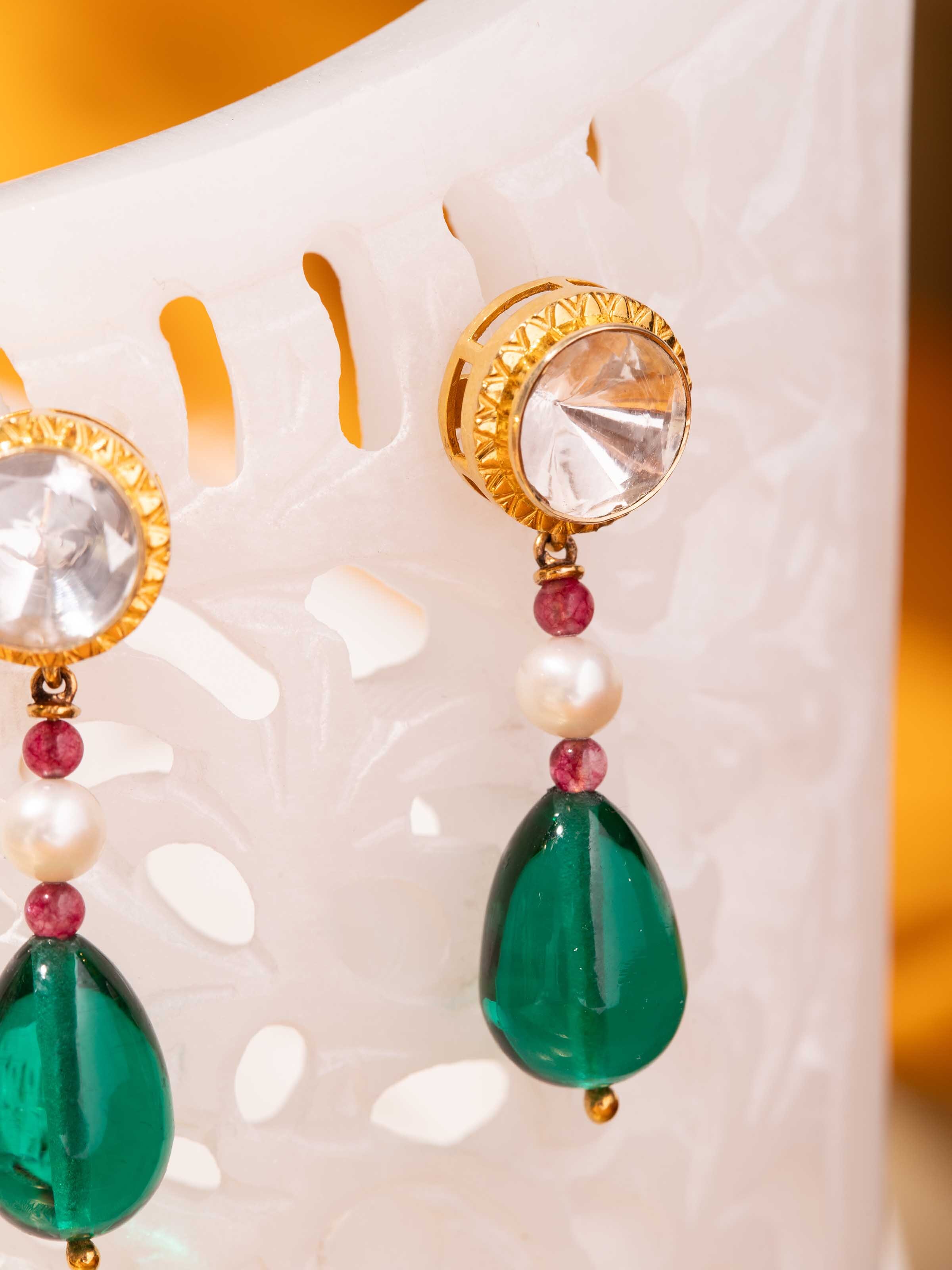 Detail shot showing craftsmanship and texture of alternate Dank Polki earrings.