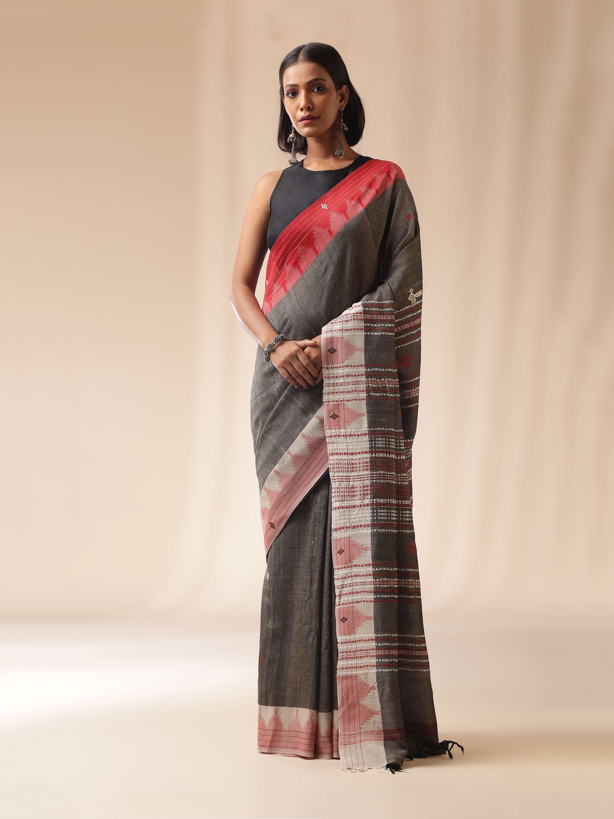 Lifestyle view of brown Kotpad saree styled with statement blouse and accessories