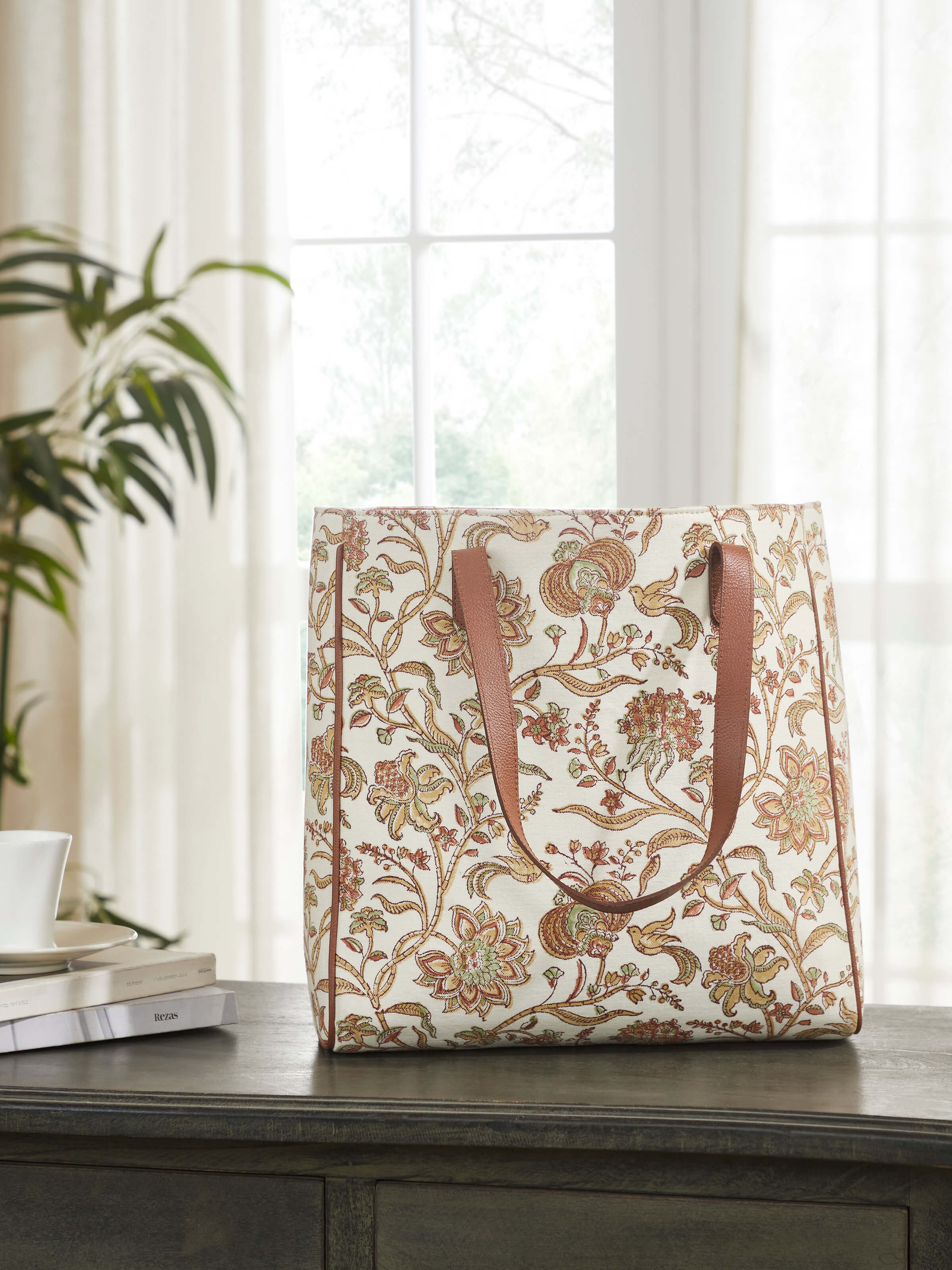 Lifestyle view of Leather & Textile Hand Block Printed Tote Bag displaying spacious design and embroidered details.