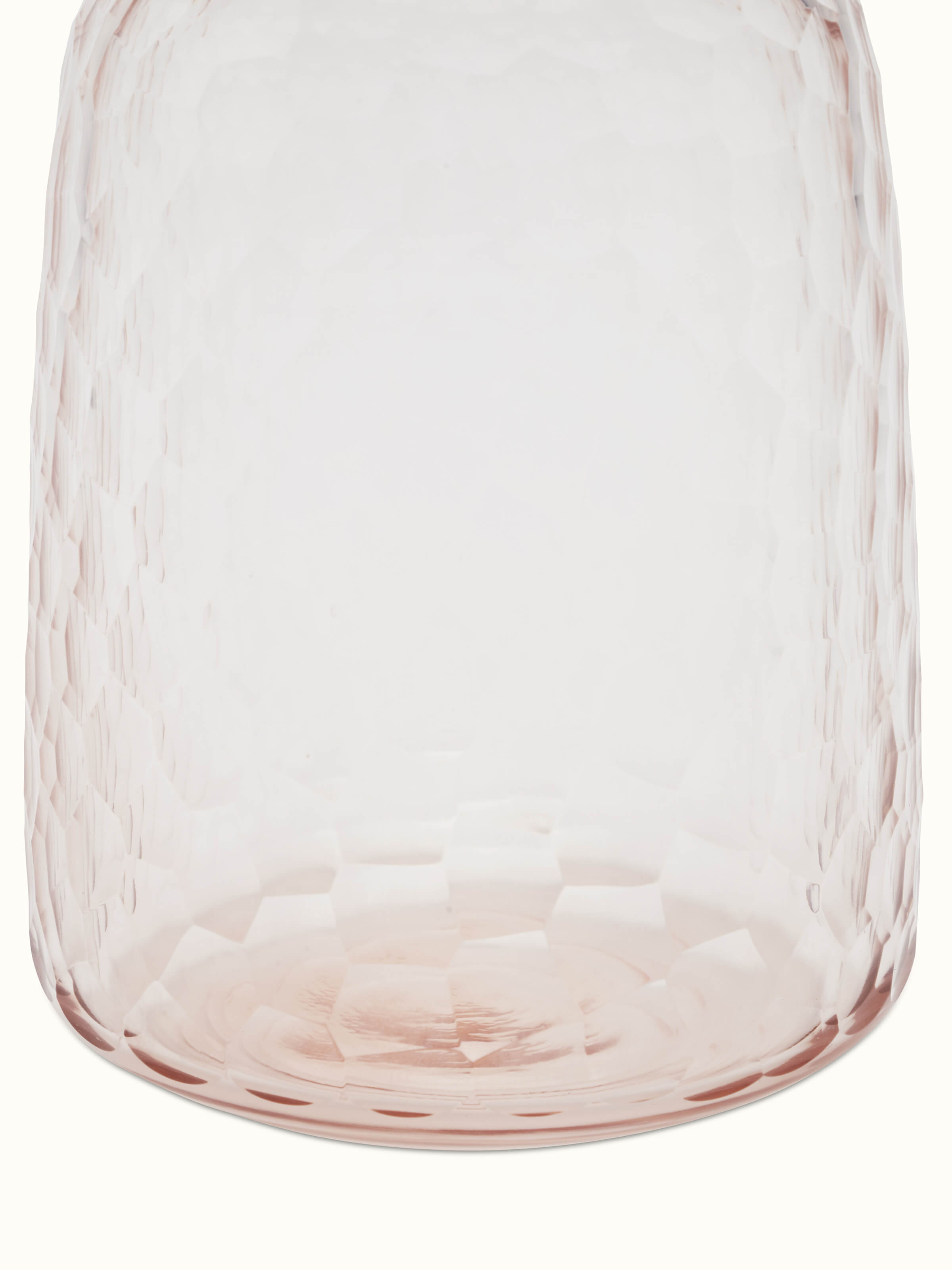 Artistic view of glass table vase in peach color, showcasing the overall design and color.
