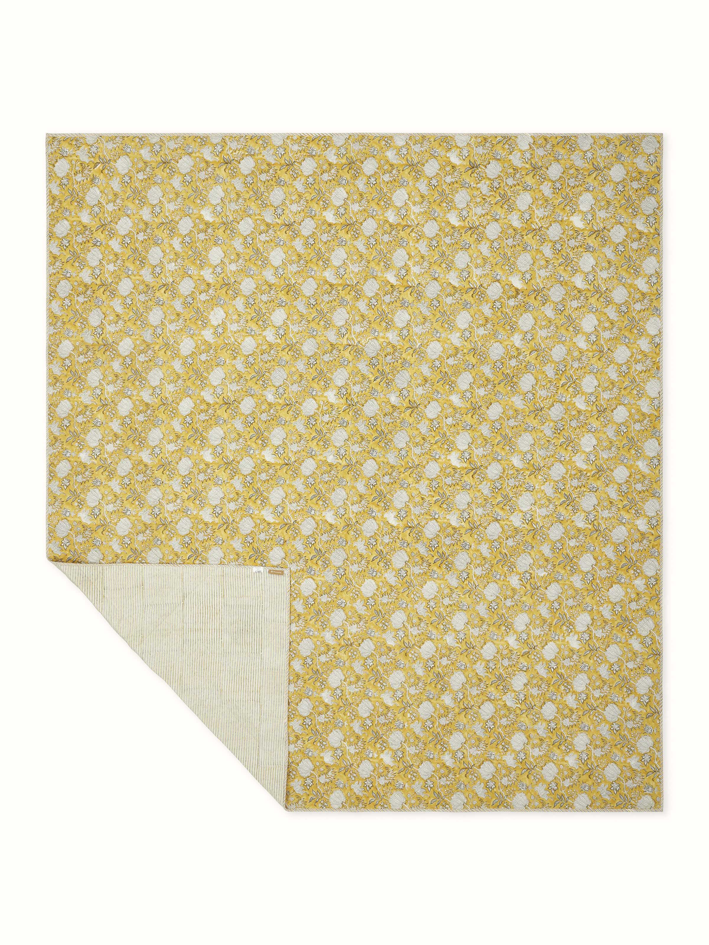 Back view of Kairavam Yellow Floral Sanganeri Hand Block Printed Quilted Bedspread, showcasing full design layout and finishing by Swadesh