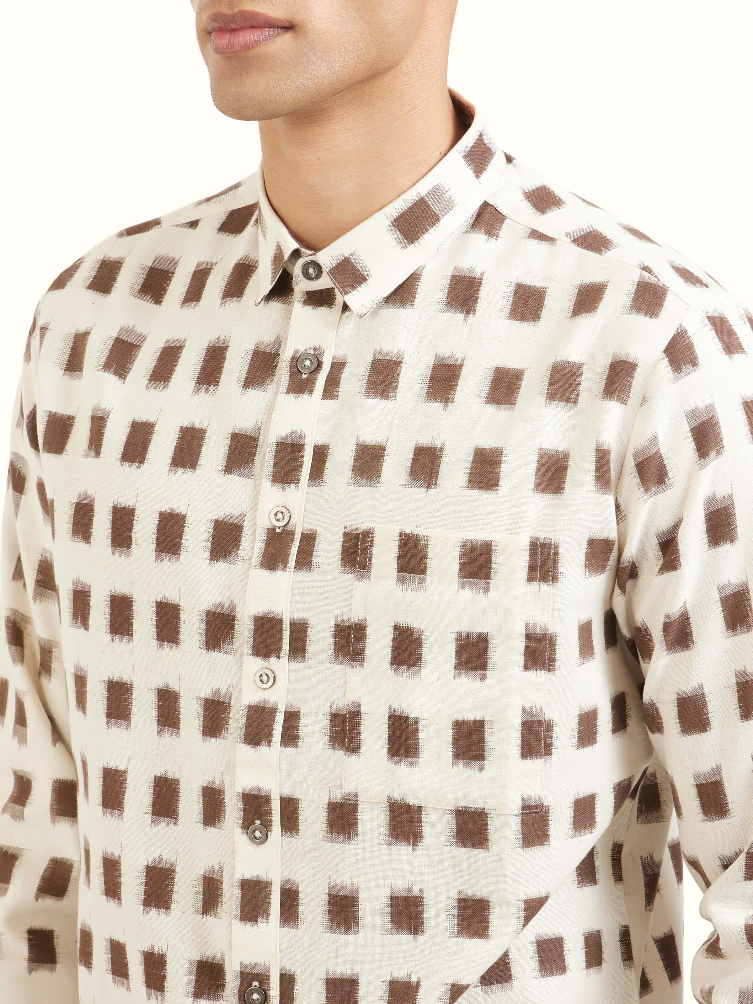 Detail view of white cotton Telangana Ikat shirt showing cotton texture and craftsmanship