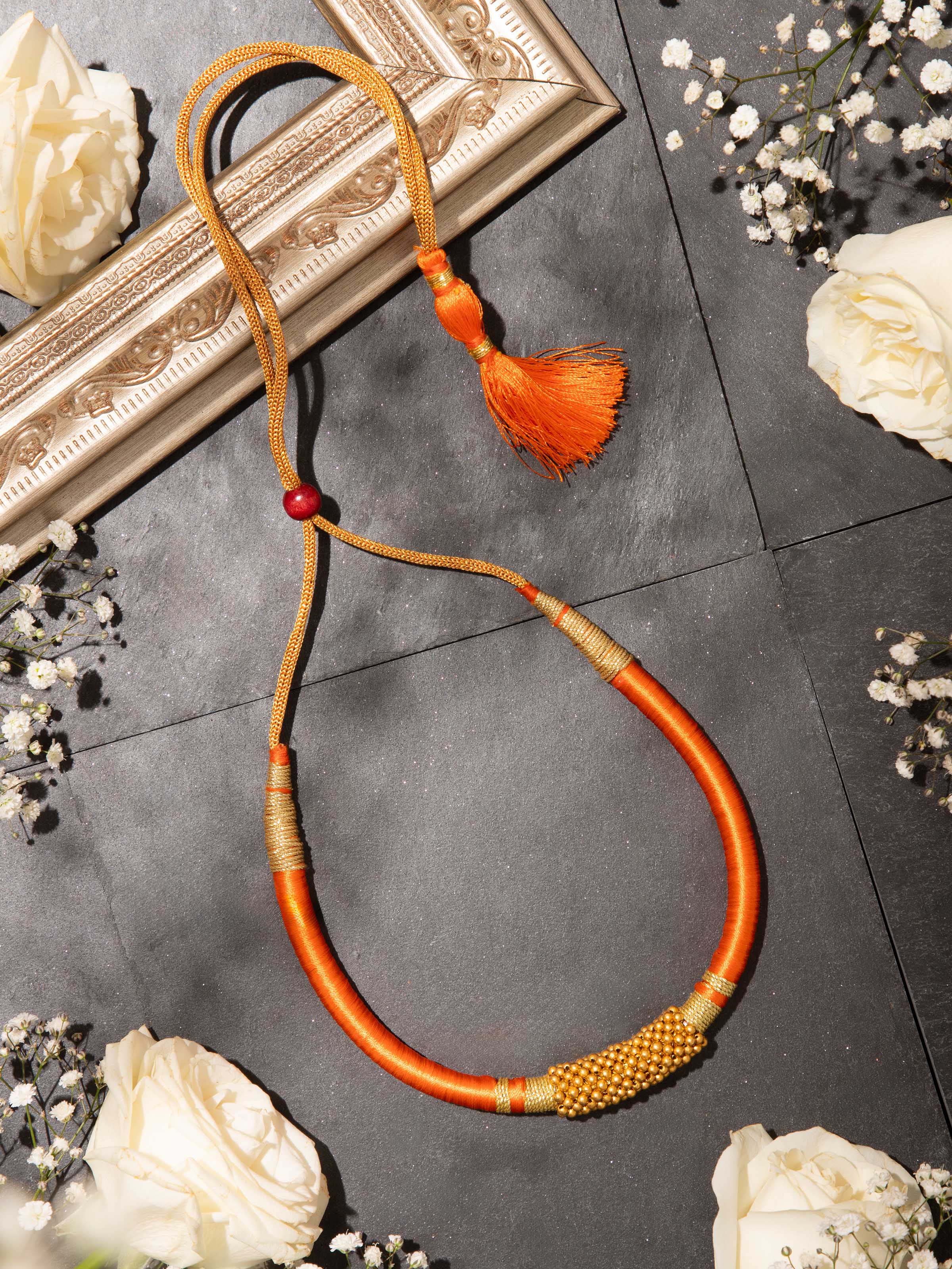 Thushi 22 karat gold collar necklace worn on neck