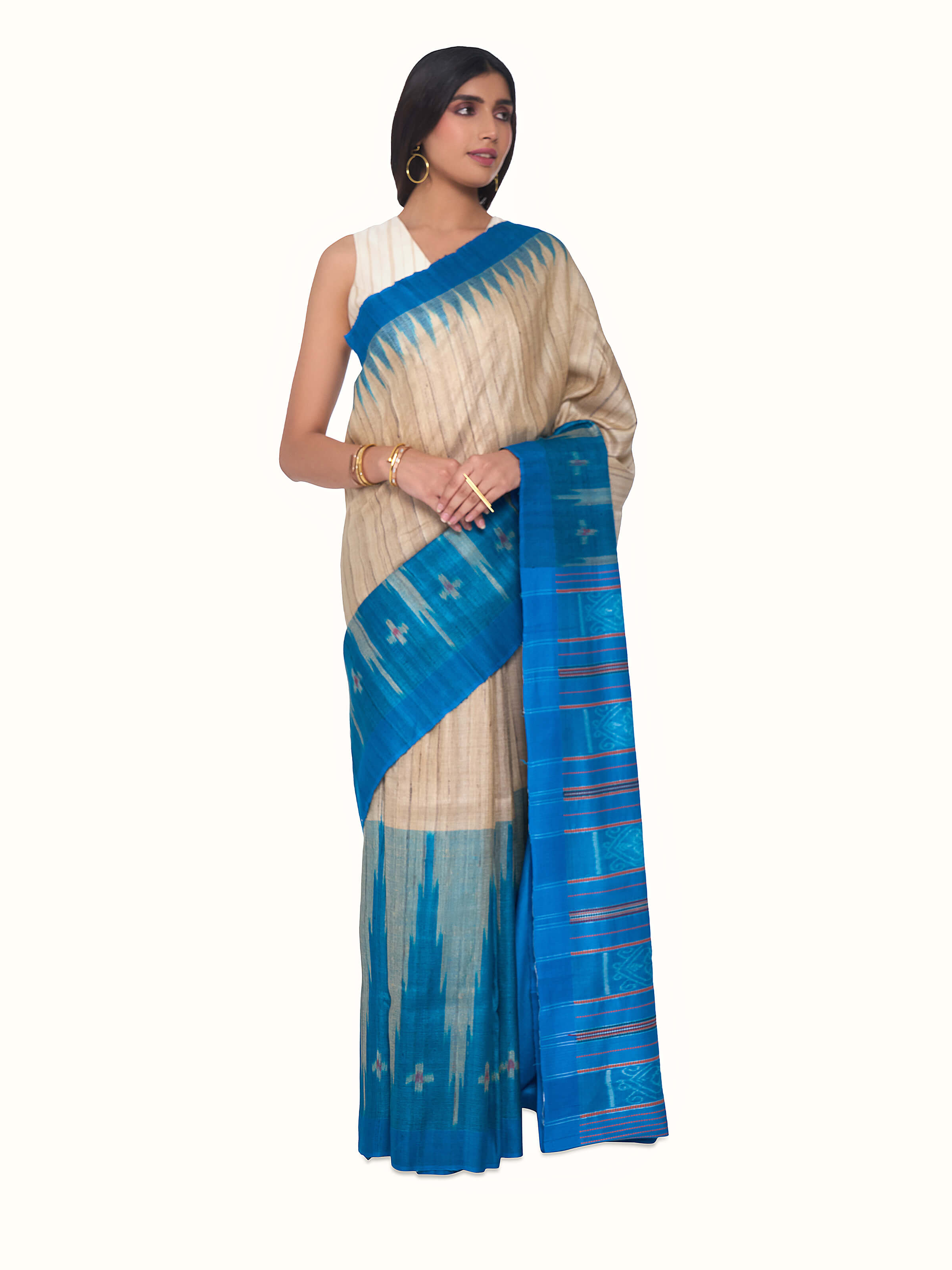 ront view of turquoise tussar ghicha silk Bandha ikat saree with traditional woven patterns