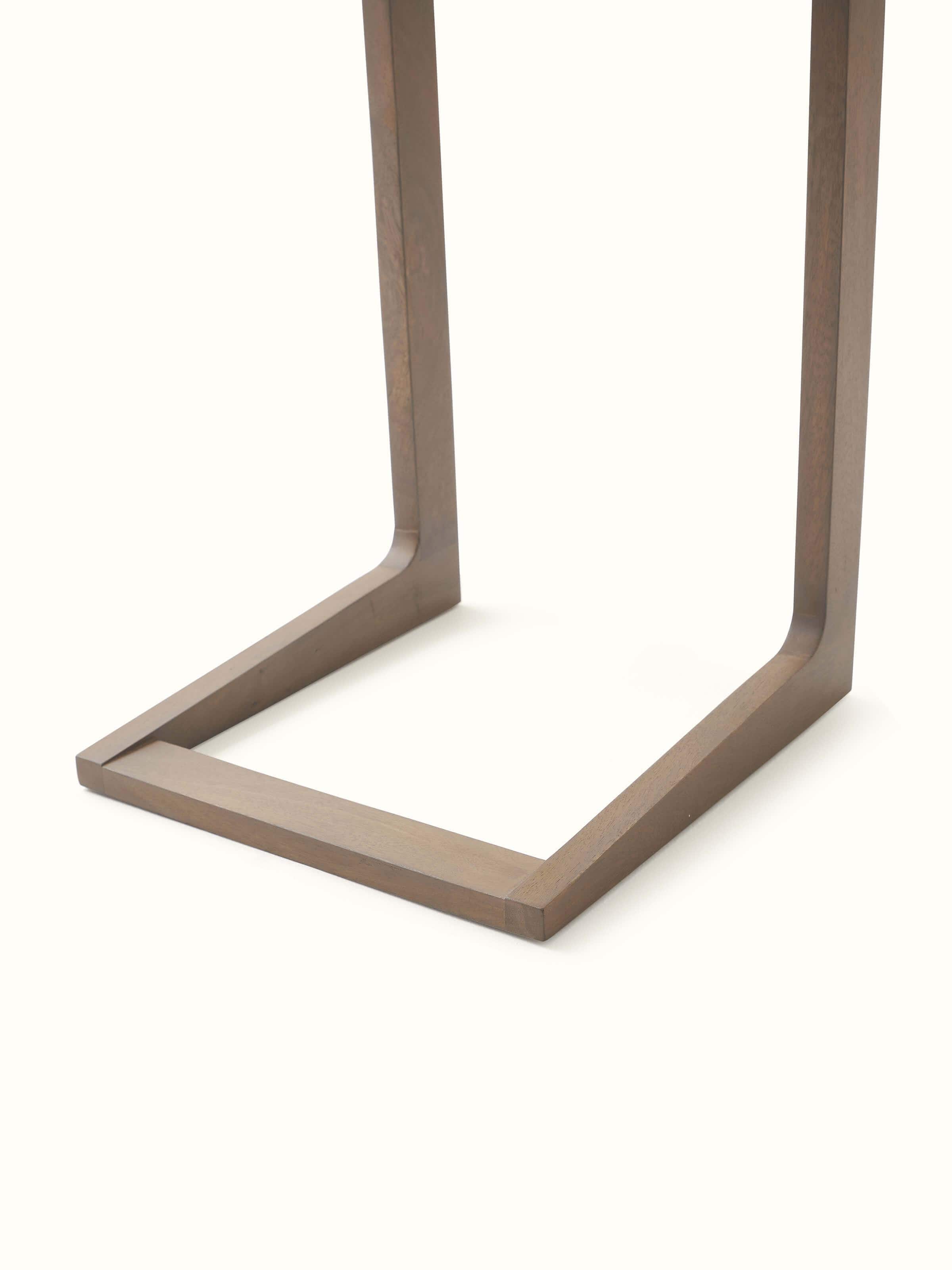 Detailed view of the mango wood finish and miniature painting on the portable table