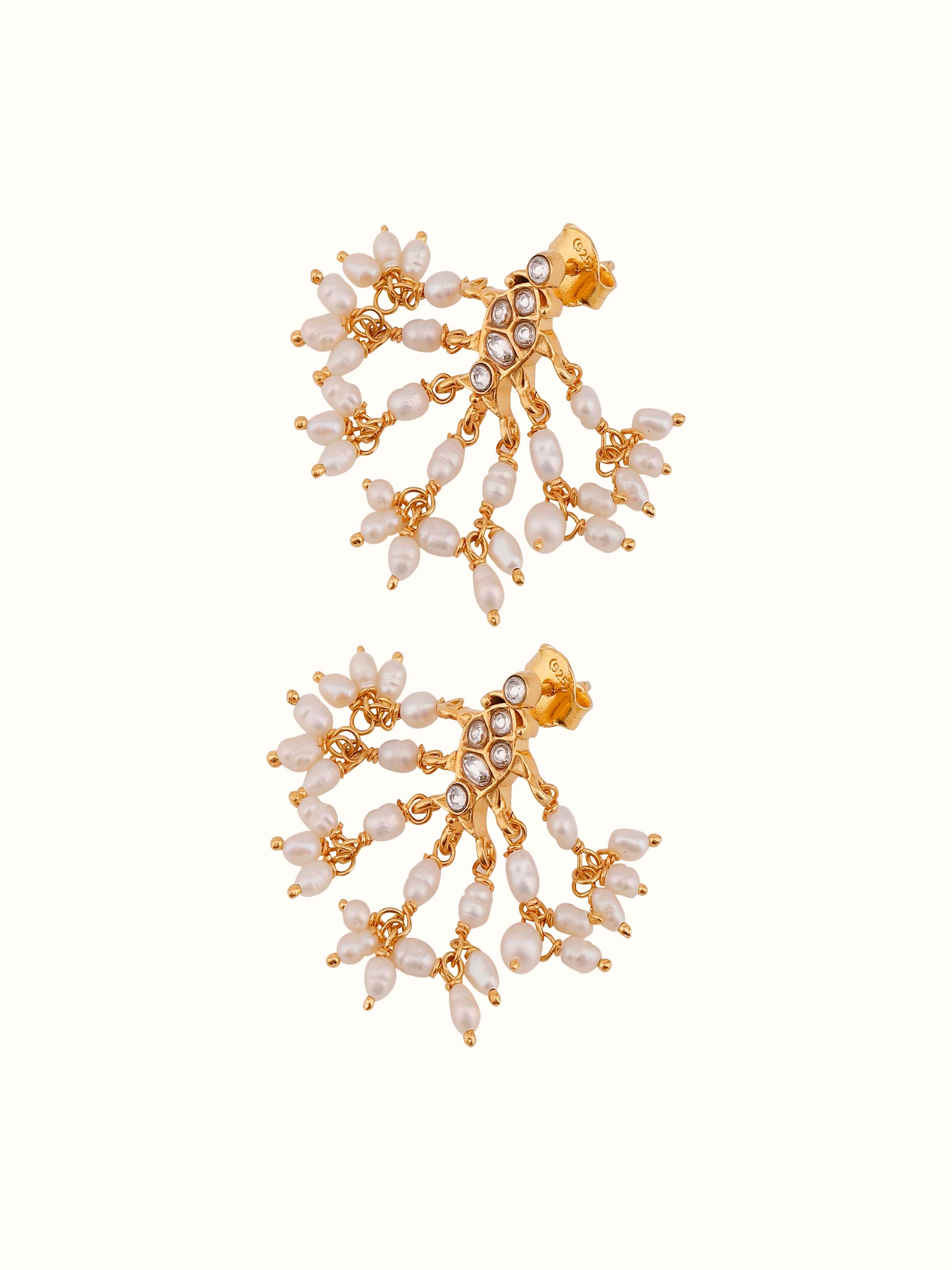 Overhead view displaying the crescent structure of Guttapusalu Silver Drop Earrings.