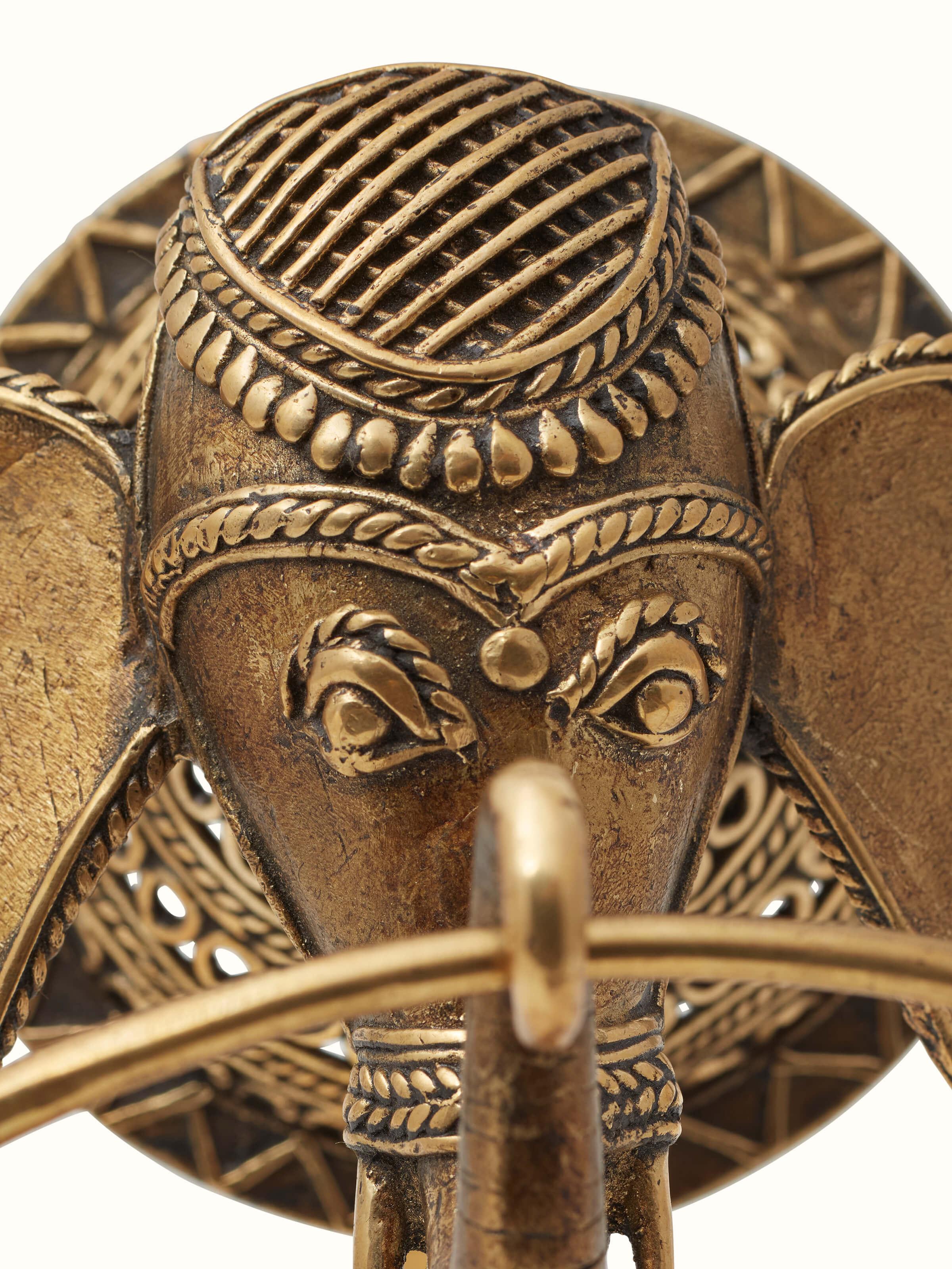Angled view of Dhokra Brass Elephant Towel Ring showing its decorative and functional design