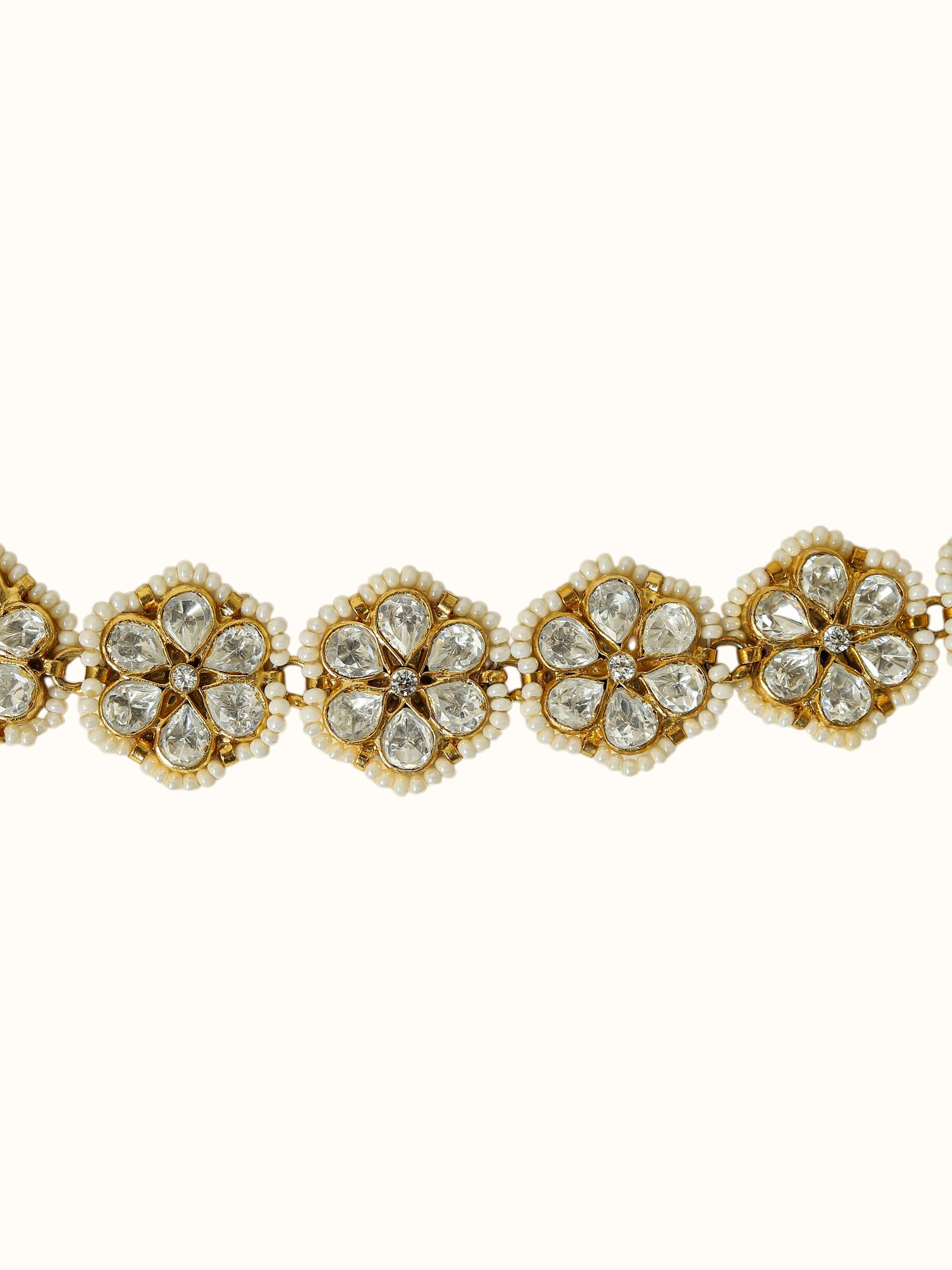 close-up view of silver smithing pure gold plated waistbelt detailing