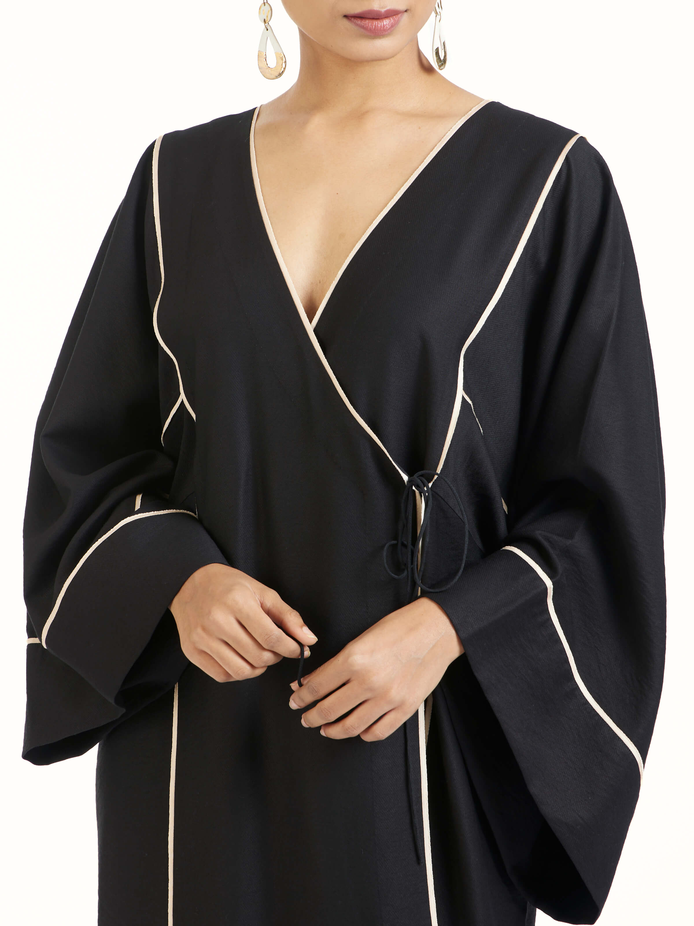 Detail view of black shibori kimono dress showing fabric texture and print