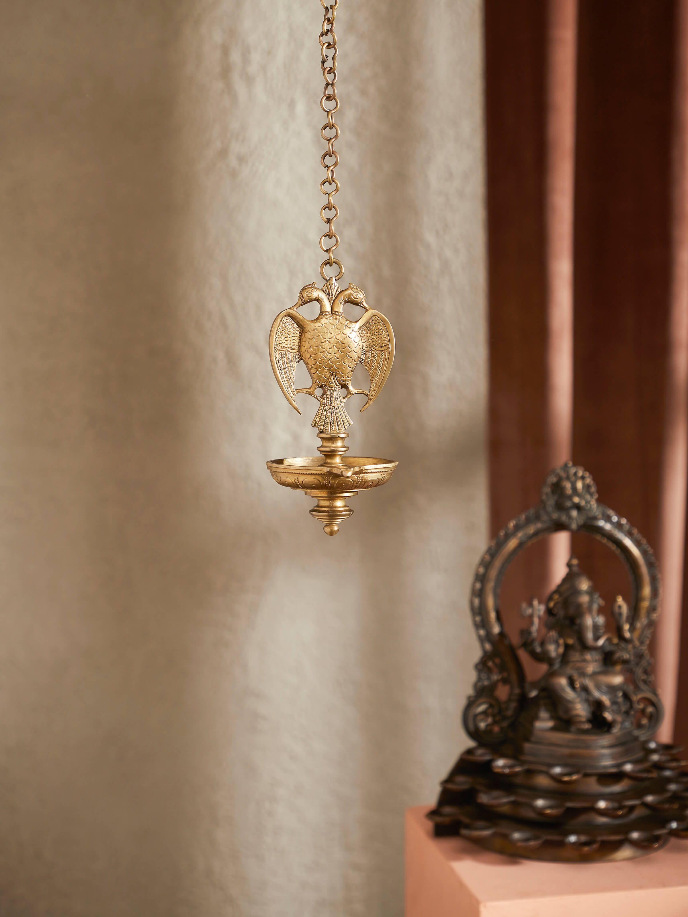 Side view of Polished Bronze-Cast Hanging Diya showcasing elegant craftsmanship