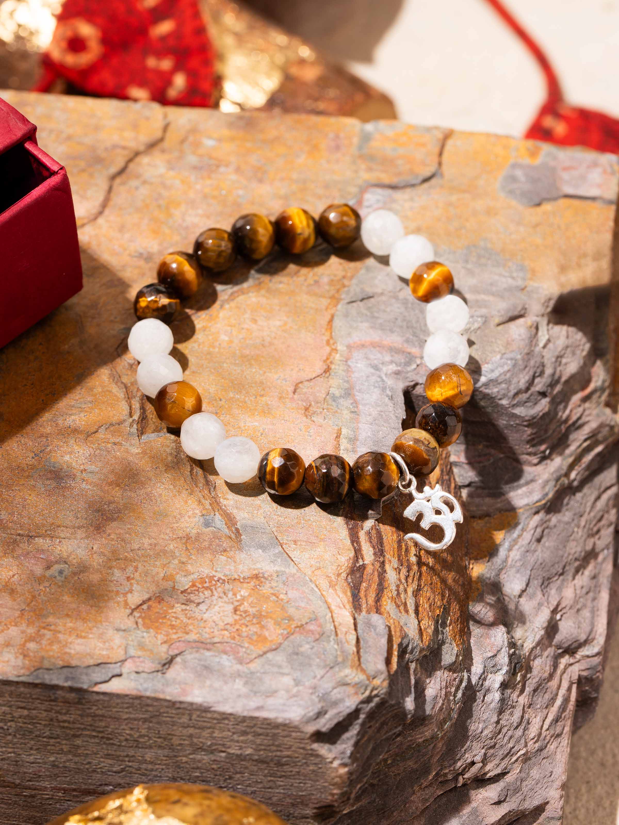Side view of Tiger Eye & White Moonstone Bracelet displaying stone arrangement and fine silver detailing
