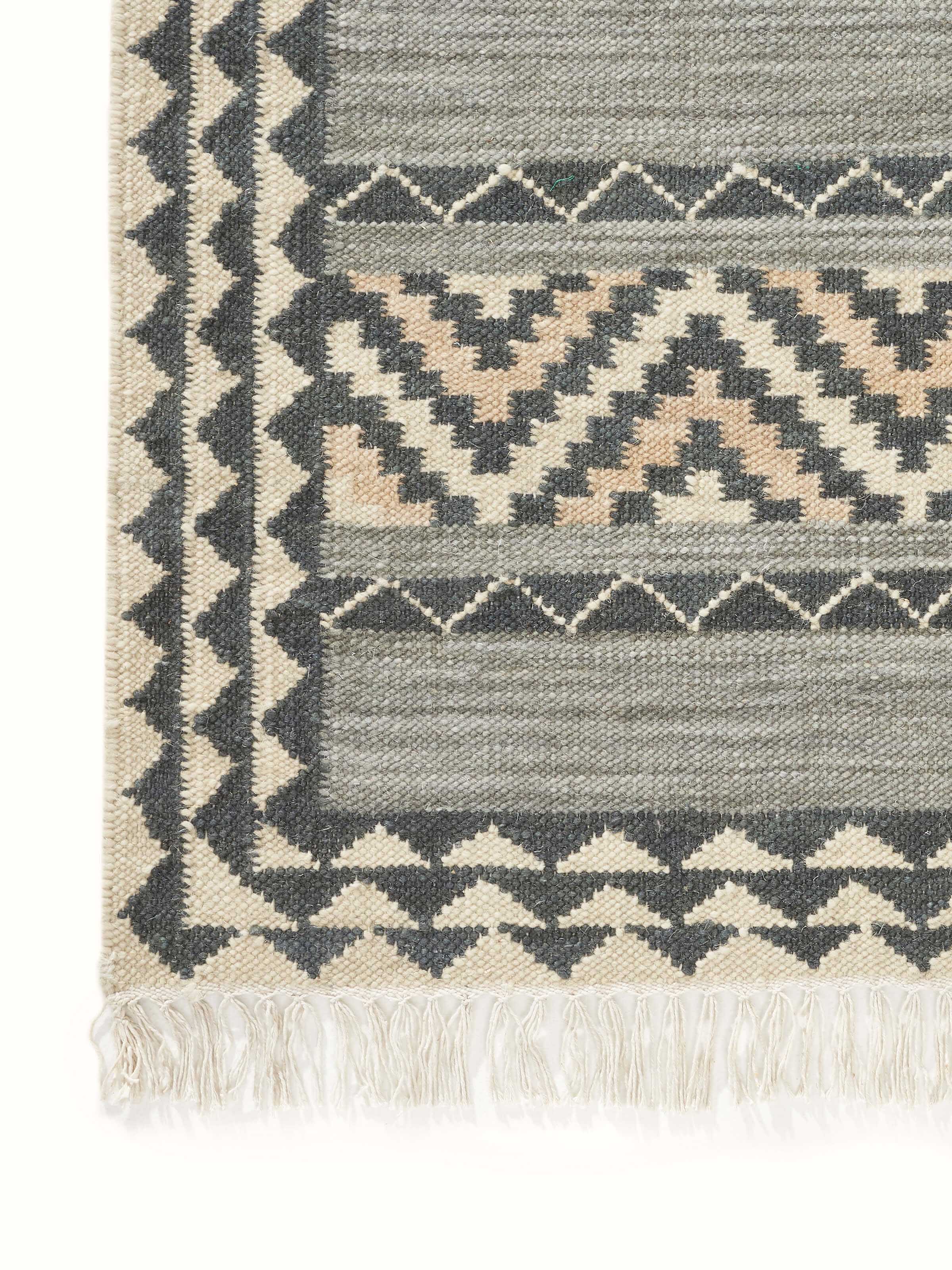 Close-up focusing on the wool weave and craftsmanship details