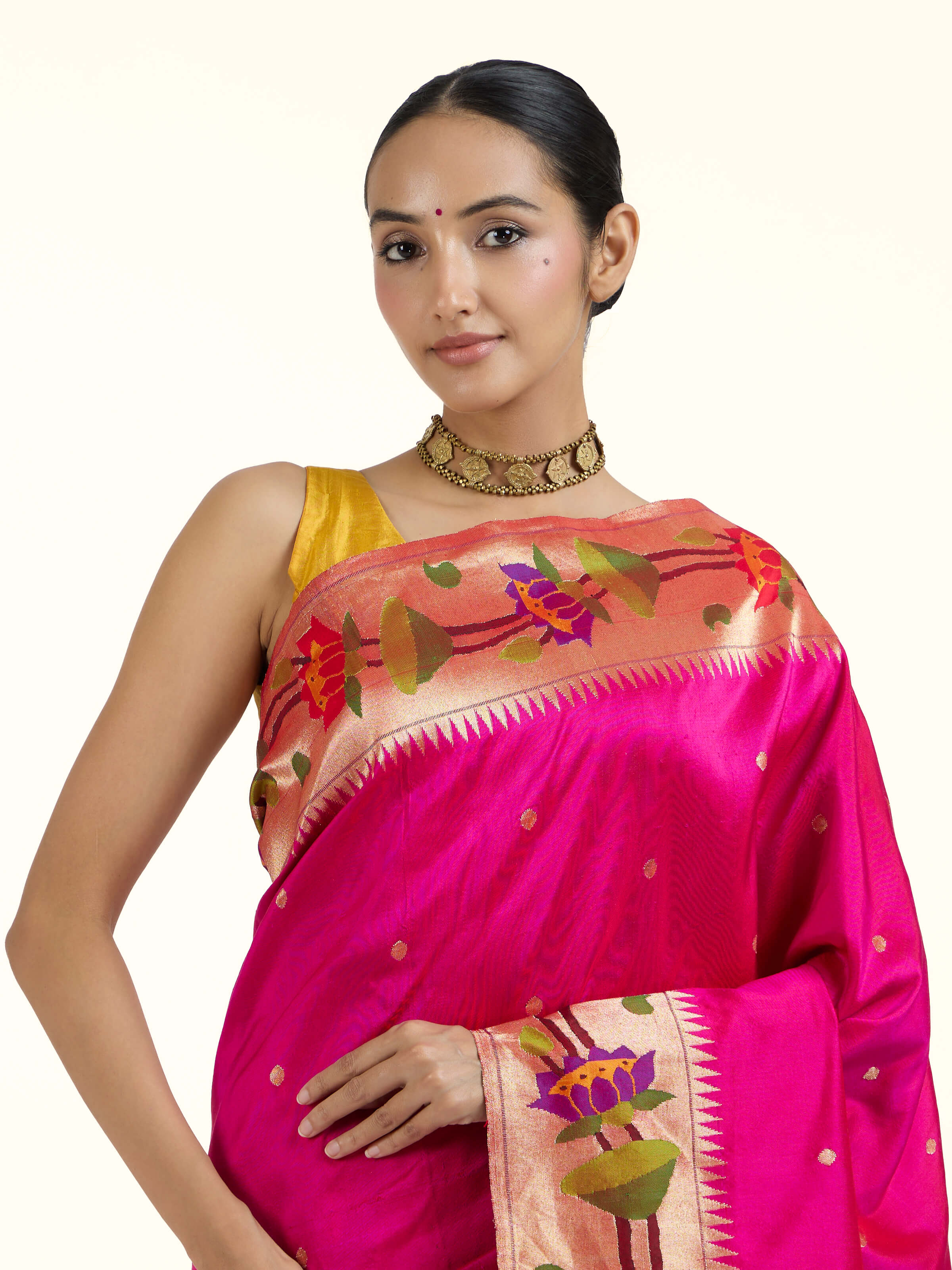 Angled view of purple silk Paithani saree highlighting classic Paithani craftsmanship
