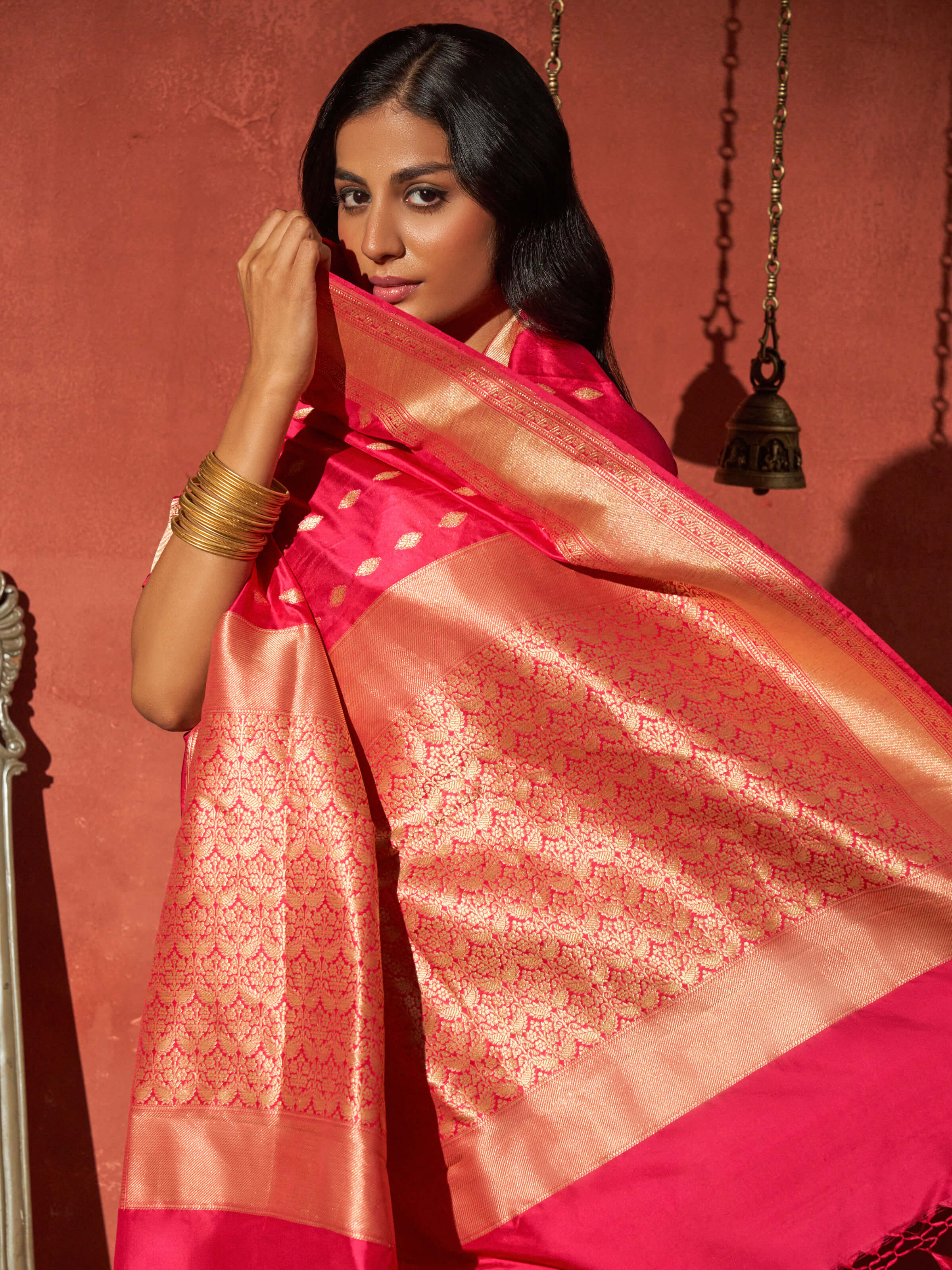 Angled view of purple mulberry katan silk Banarasi saree with traditional zari work