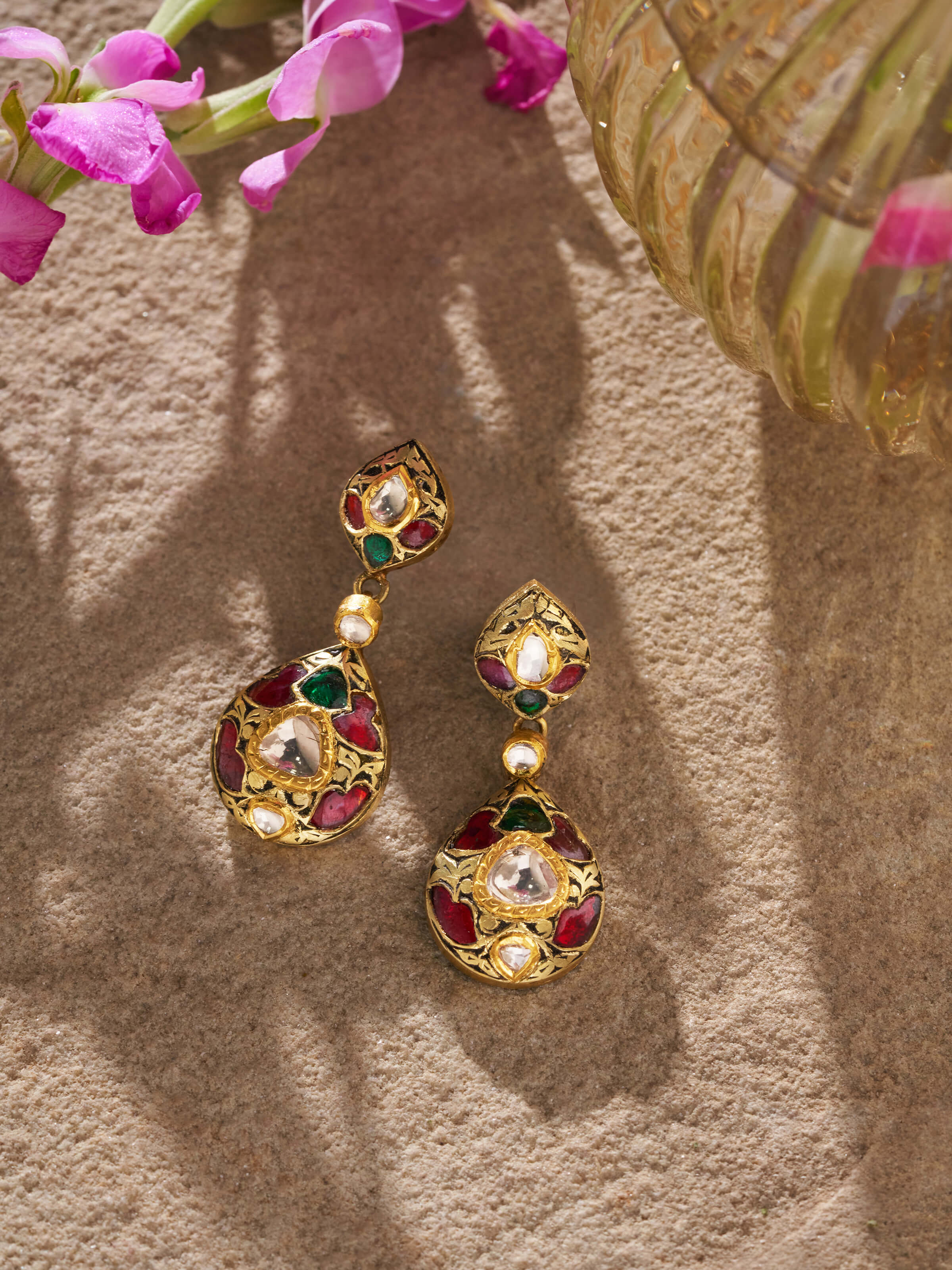 Close-up of Partash 18 Karat gold drop earrings showing intricate design details