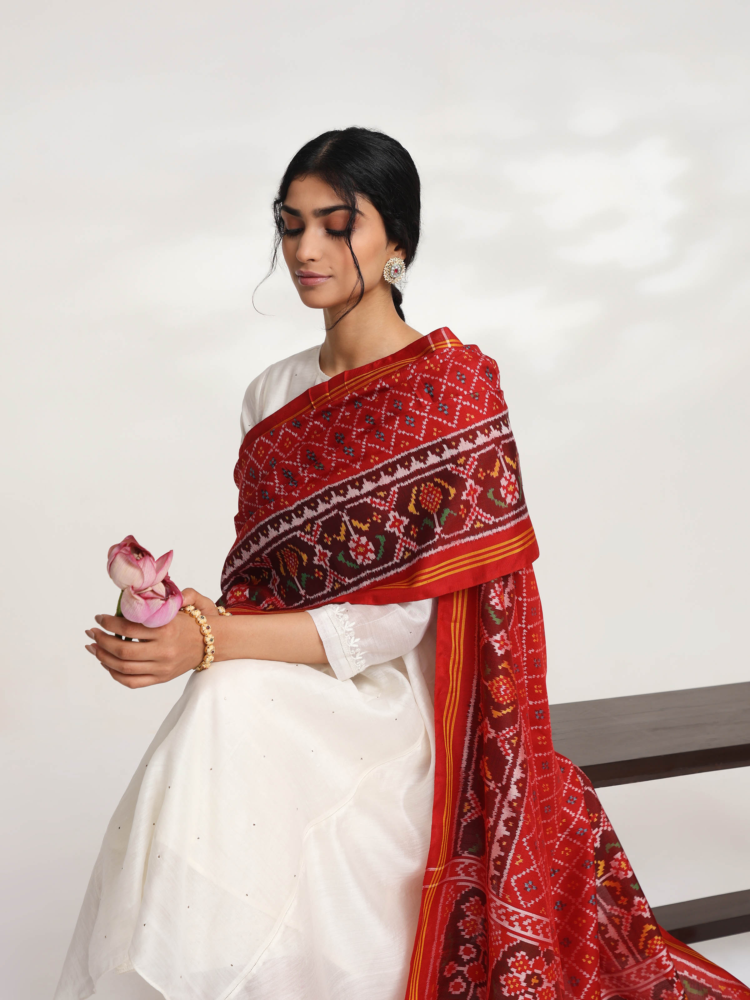 Alternate side view of red silk semi ikat Patola dupatta emphasizing ikat craftsmanship