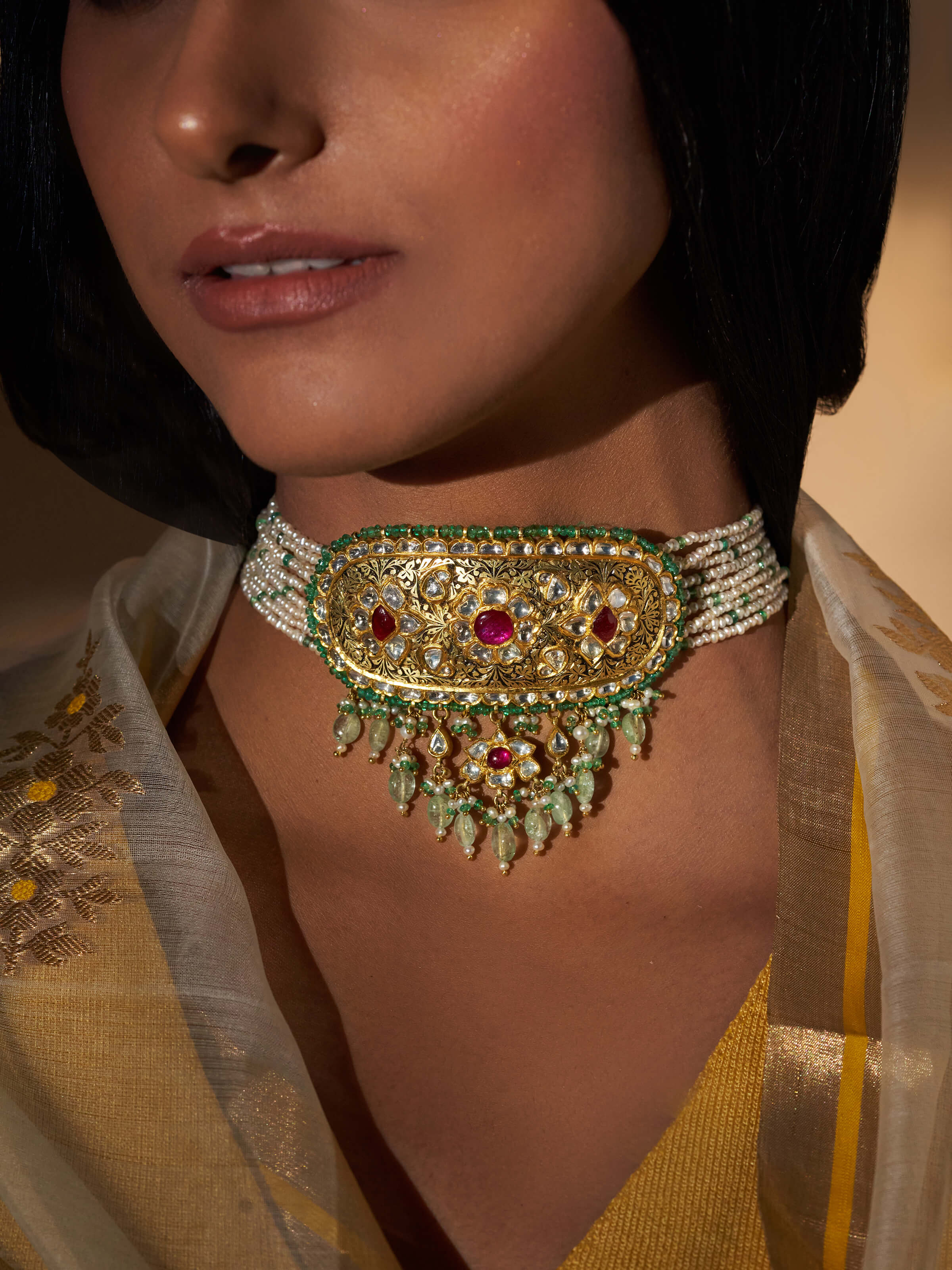 Close-up view of Partash 18 Karat gold choker styled on neck, showing fine craftsmanship and graceful design.