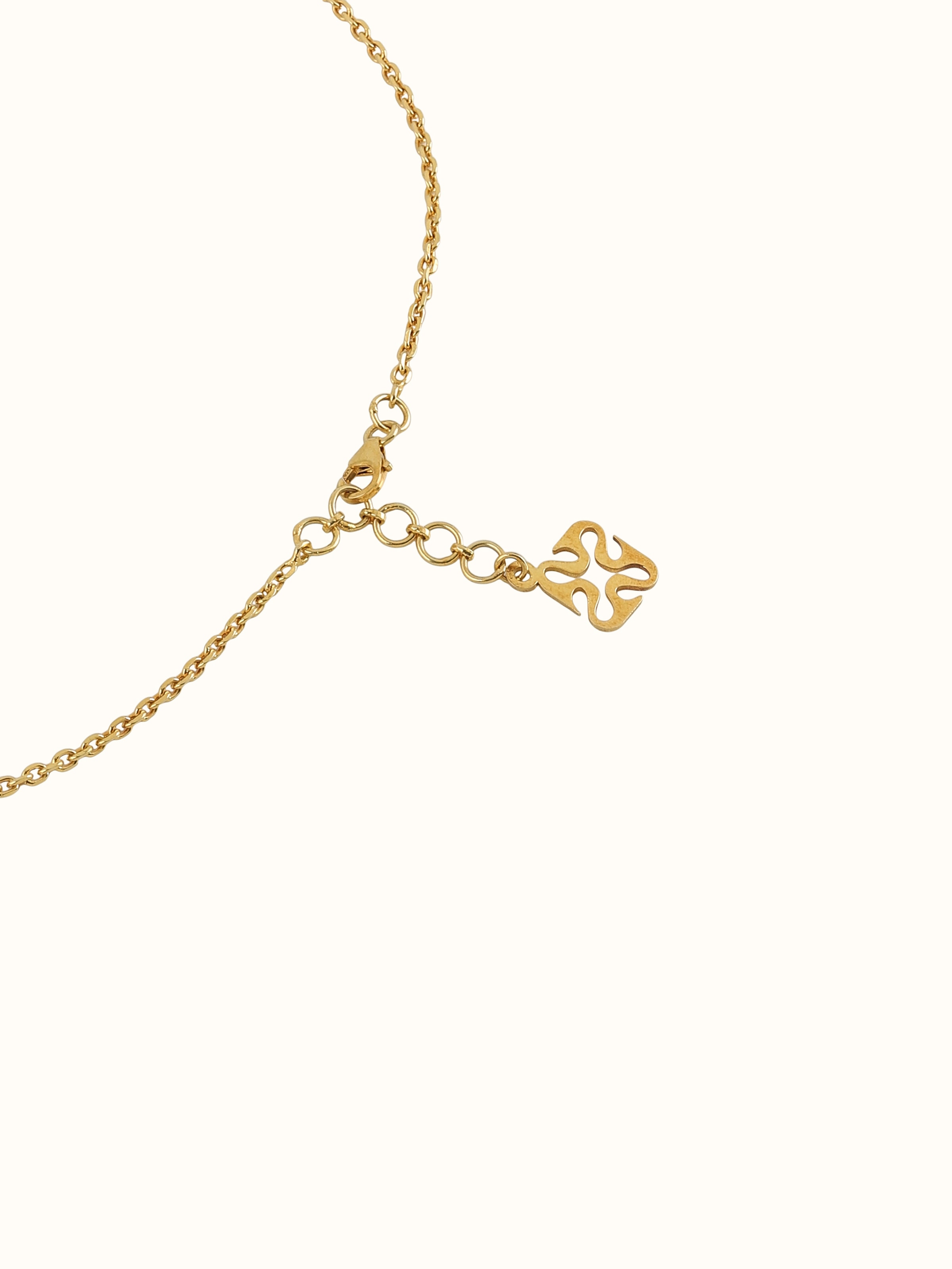 Detail shot showing close-up of pendant’s ornate floral pattern and silver finish