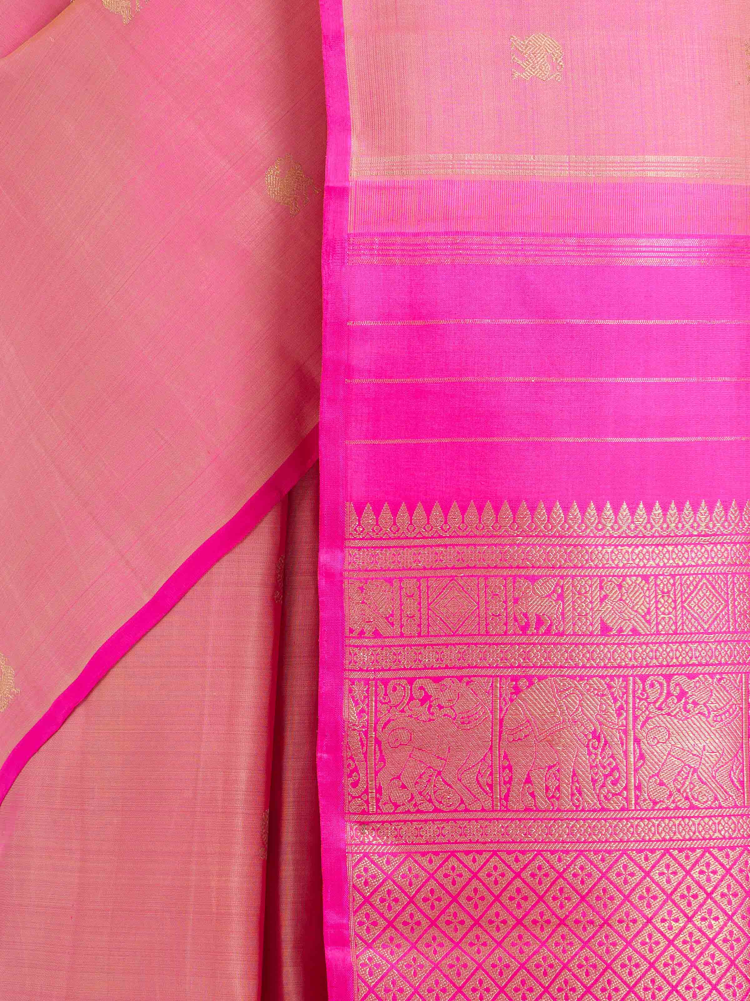 Detail view of pink silk Kancheepuram saree showing texture and zari work