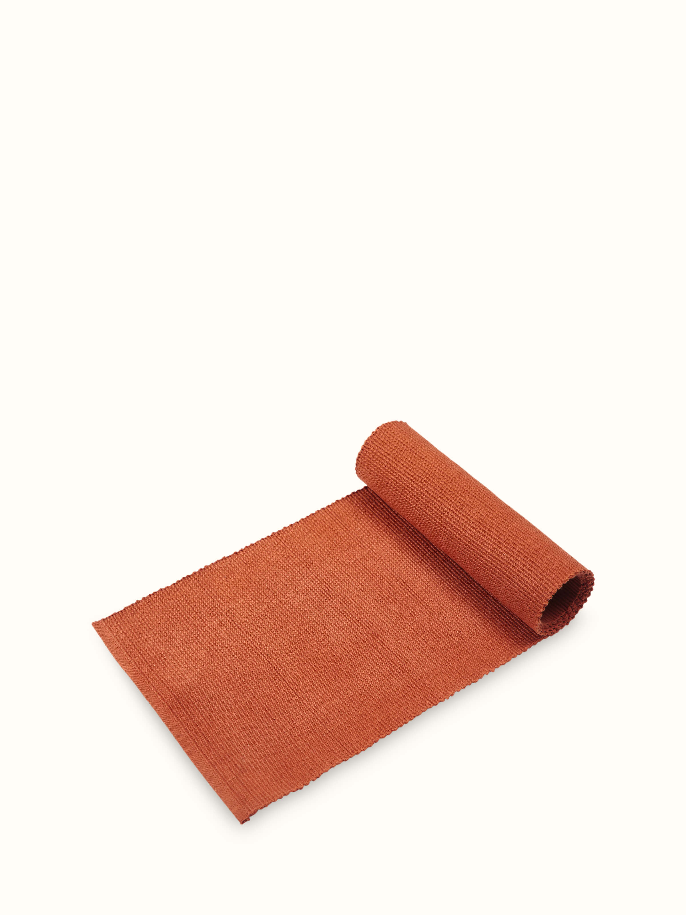 Angled close-up emphasizing the handwoven details and natural cotton fabric