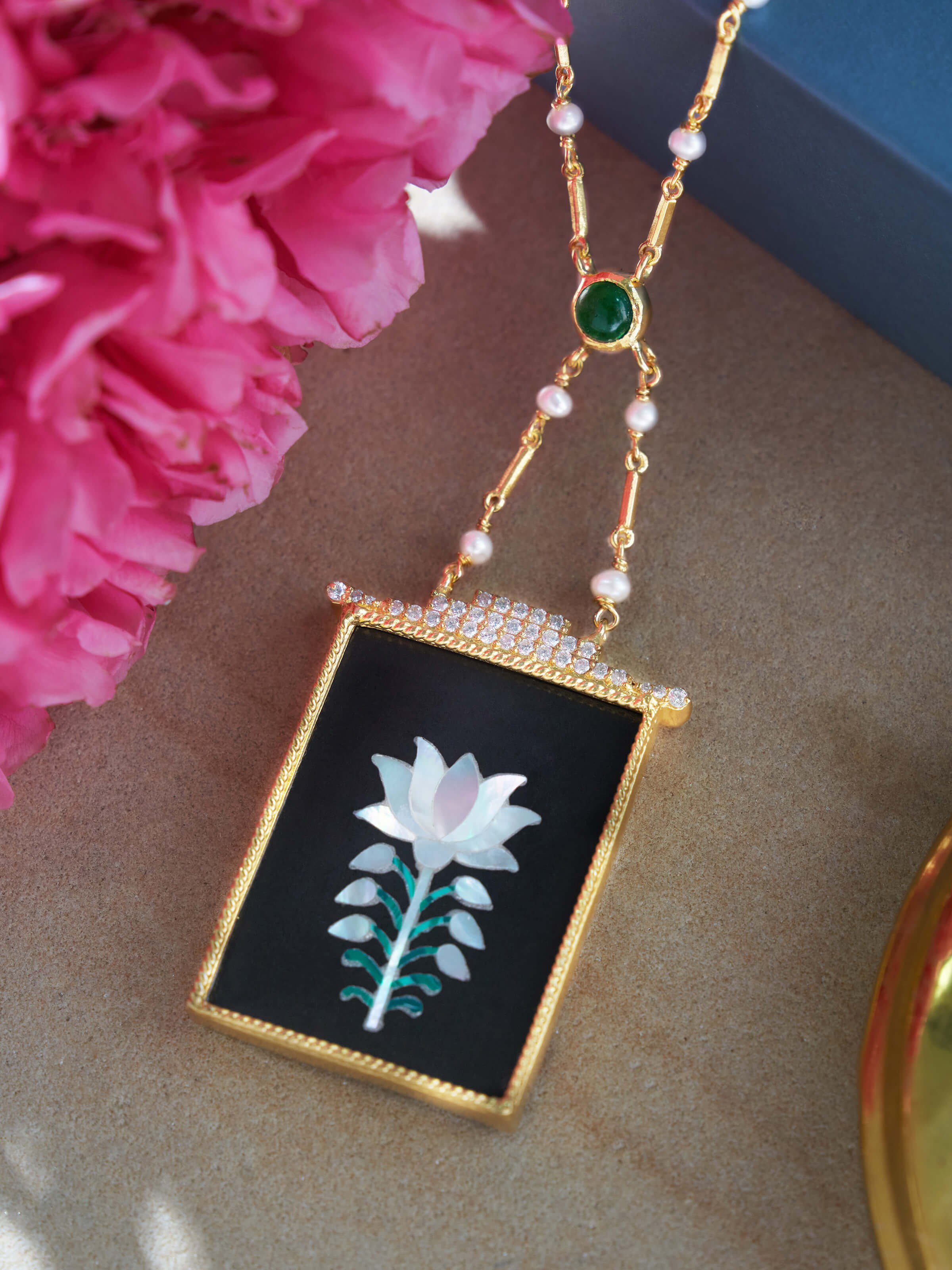 Side angle showcasing delicate craftsmanship and pendant depth