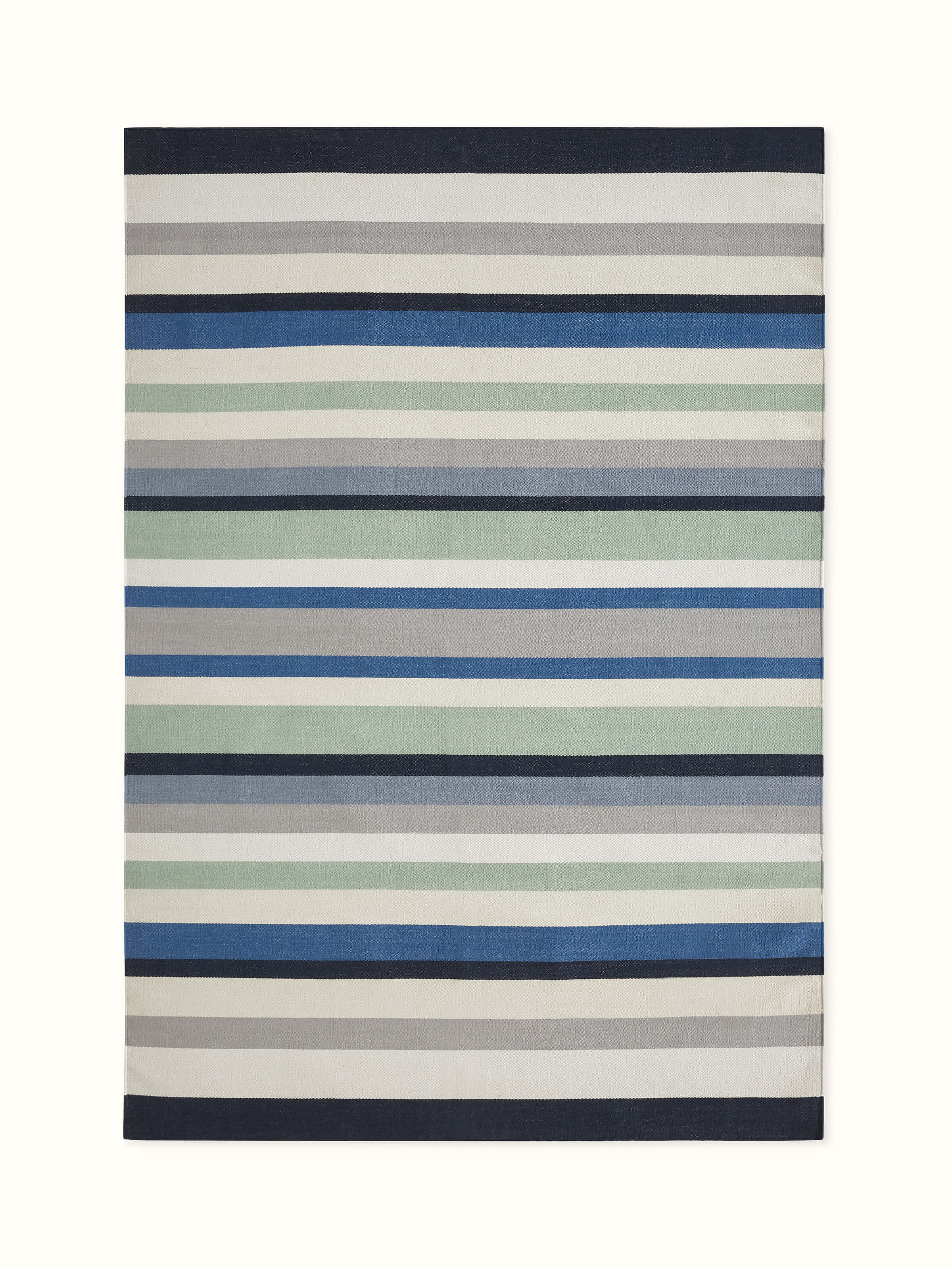 Front view showcasing the modern blue stripe pattern on the Lawan cotton dhurrie