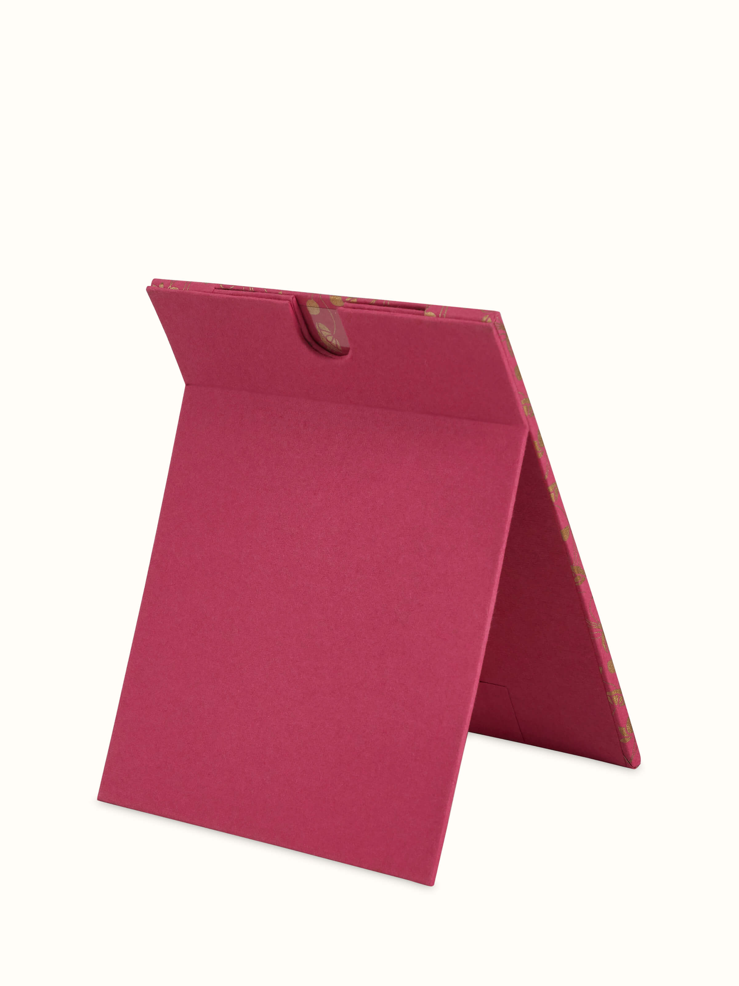 Back view of handmade paper photo frame showing stand and support