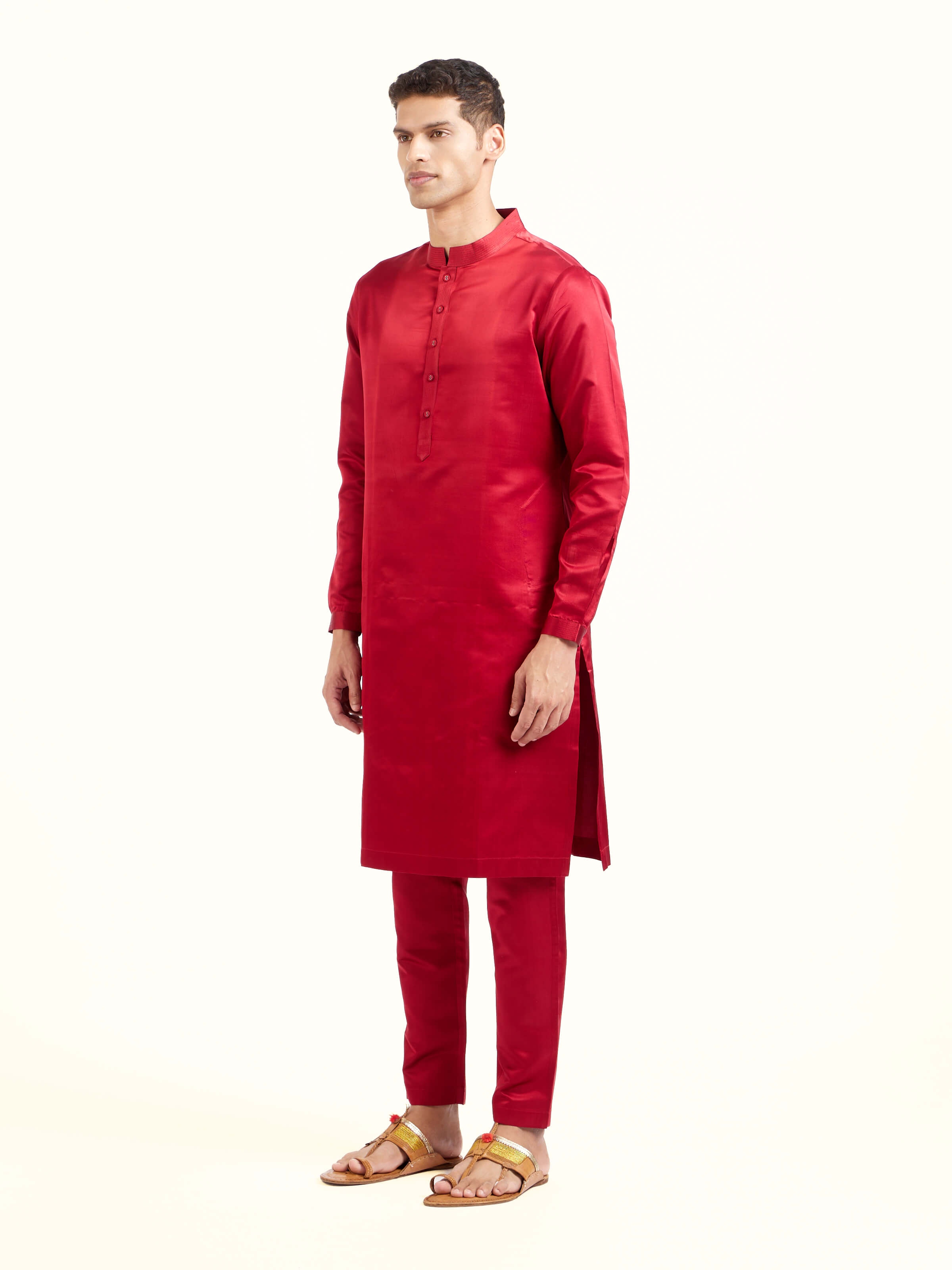Side view of maroon katan silk Banarasi long kurta churidar set with elegant silhouette