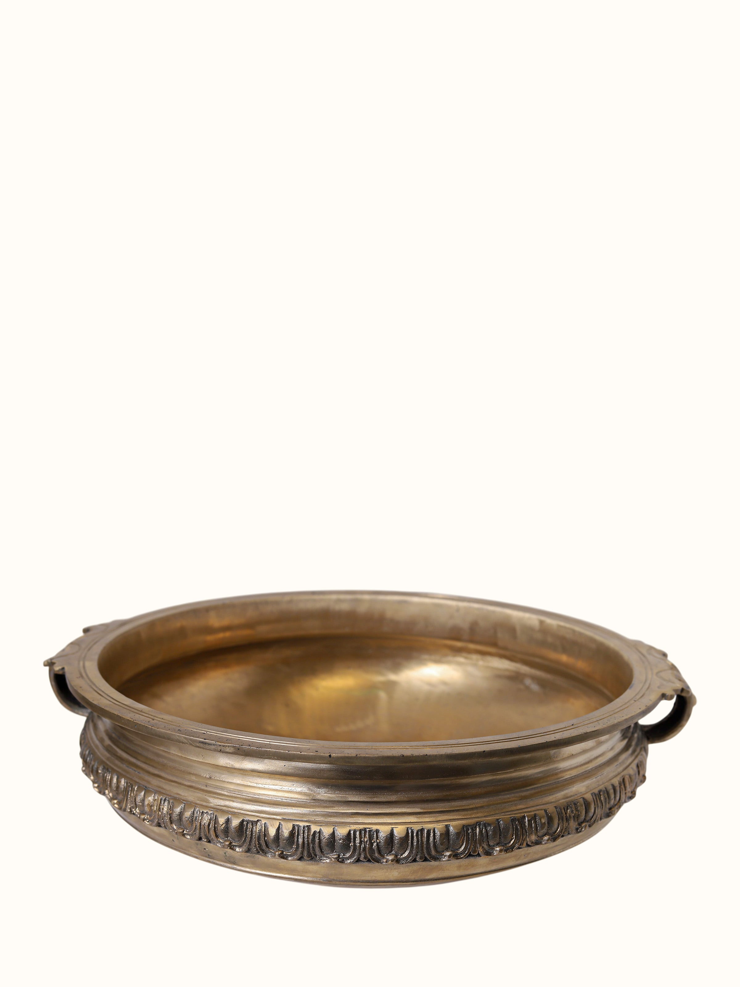 angled view of bronze casting brass urli