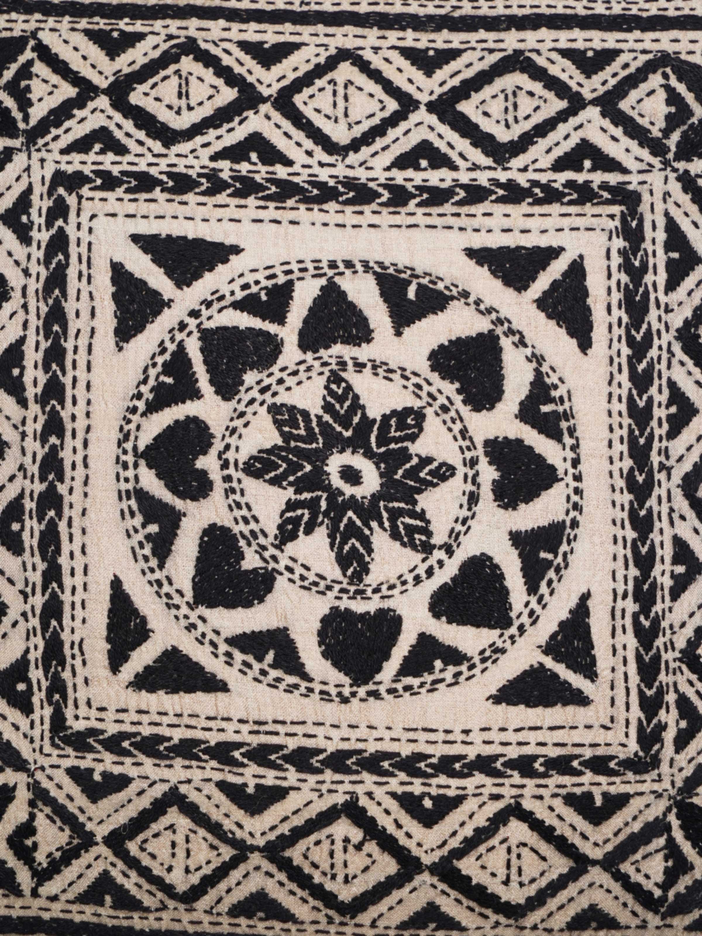 Close-up of Kantha hand embroidery on black cushion cover