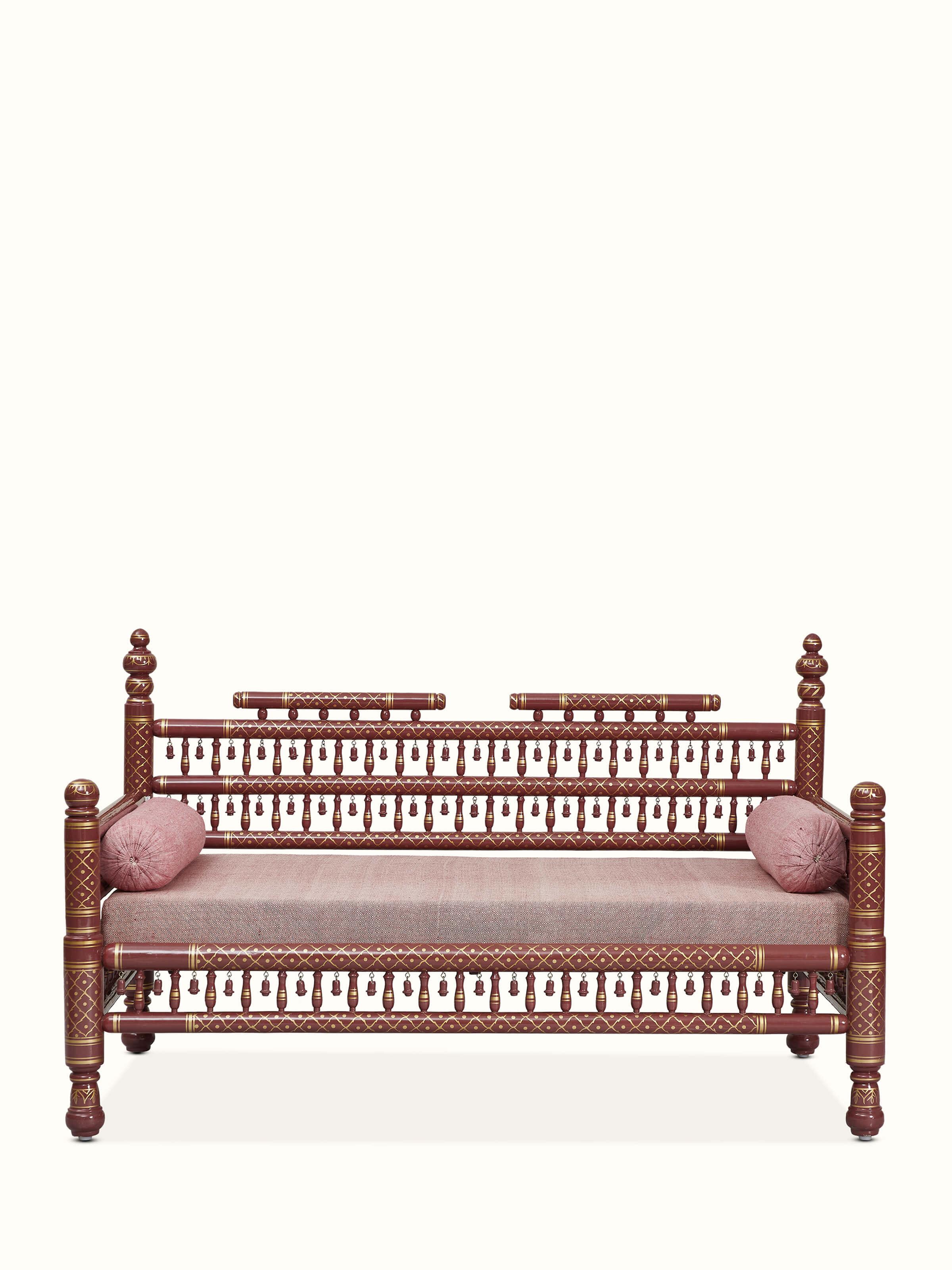 Front view of the upholstered teak wood Sankheda 2-seater sofa, showcasing its traditional design and intricate woodwork