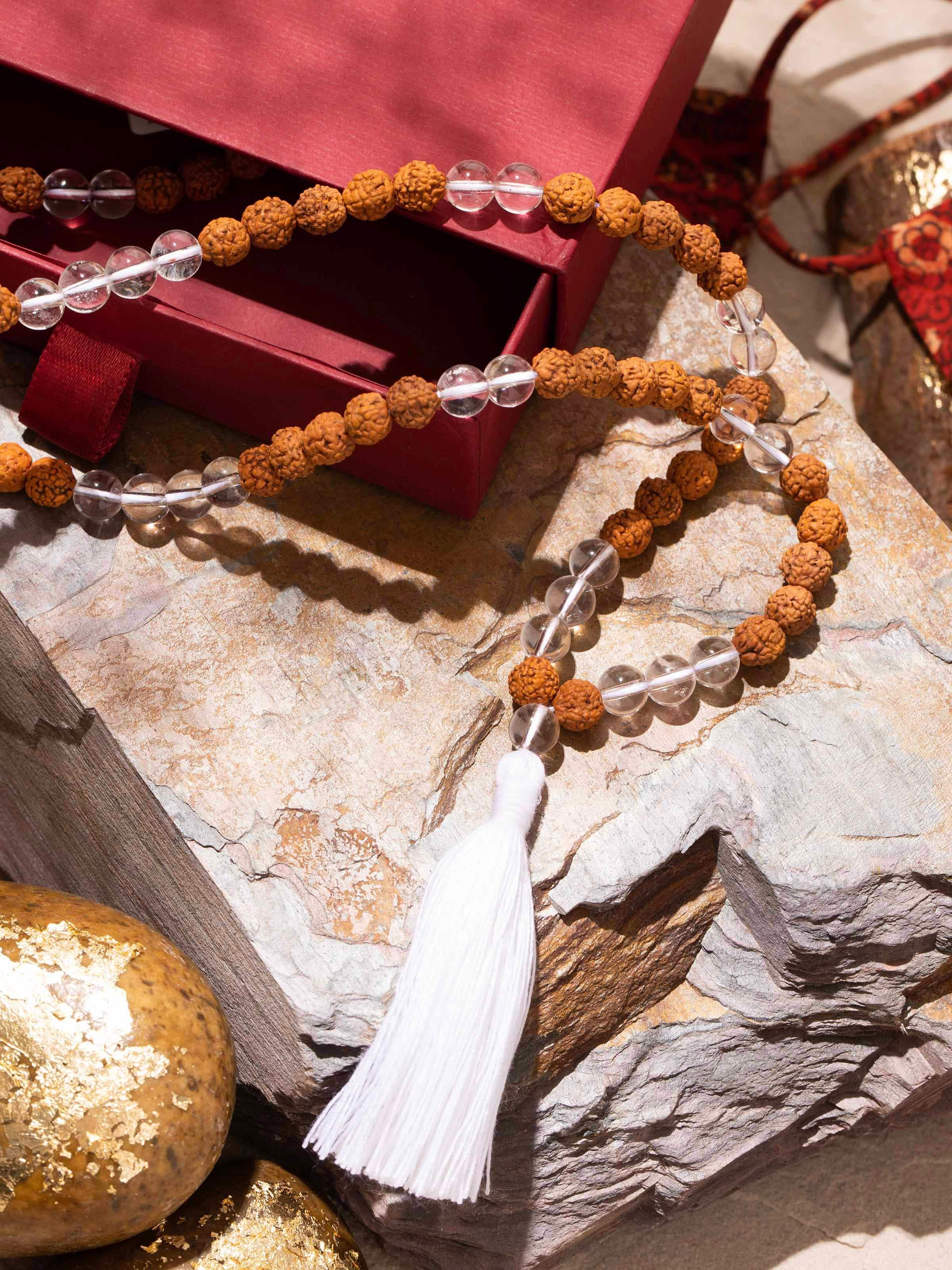 Side view of Rudraksha & Sphatik Mala highlighting clear quartz and natural Rudraksha texture