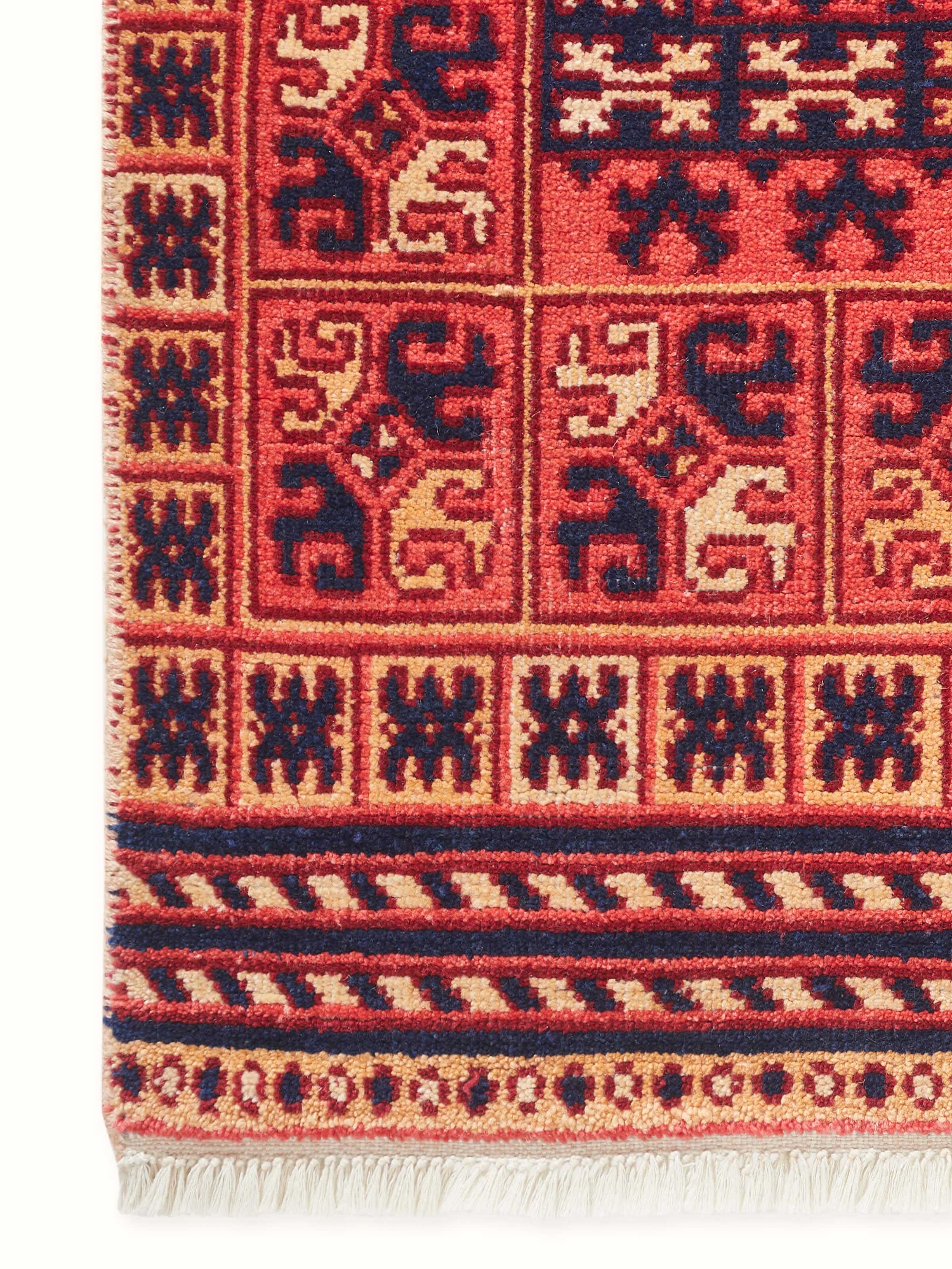 Close-up showing detailed wool fibers and fine hand-knotted craftsmanship