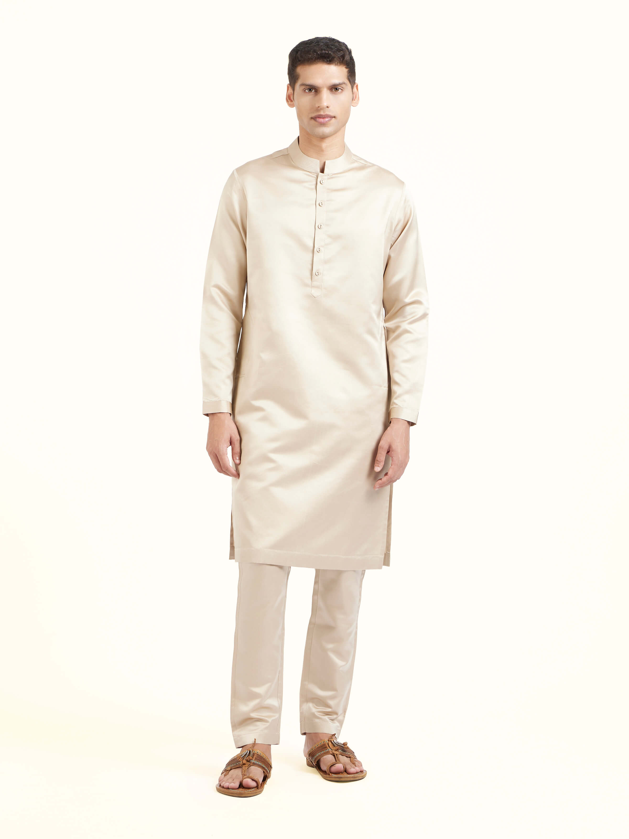 Front view of beige katan silk Banarasi long kurta churidar set showcasing elegant drape and soft hue