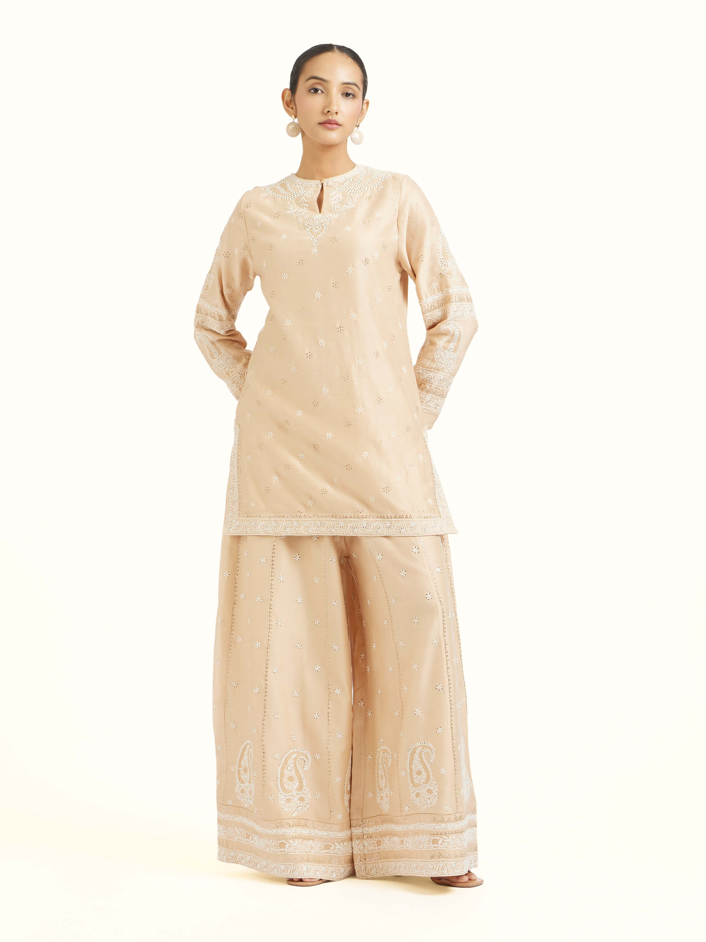 Front view of beige silk Chanderi kalidar sharara with elegant flare