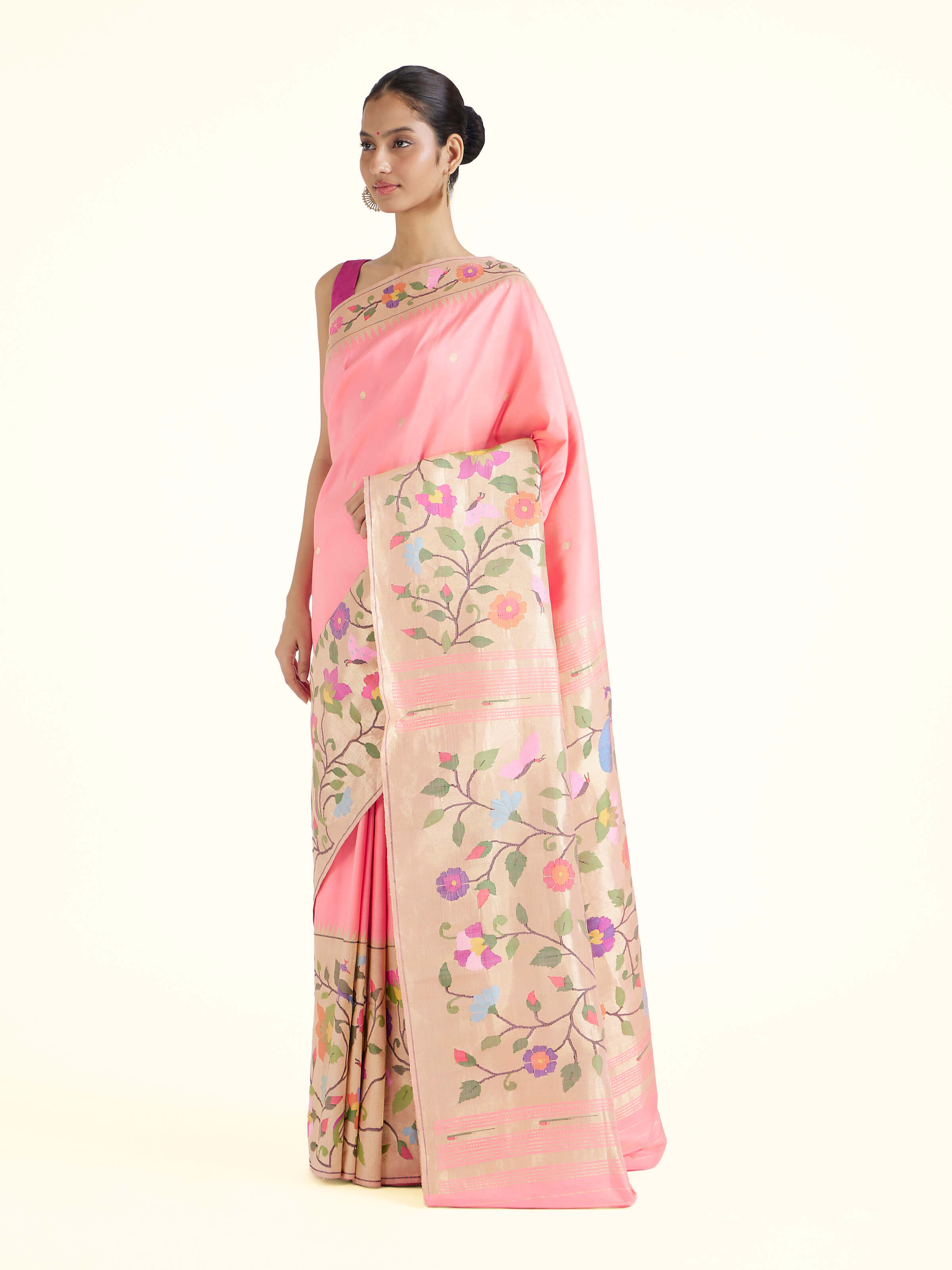 Side view of pink silk Paithani saree showcasing graceful drape