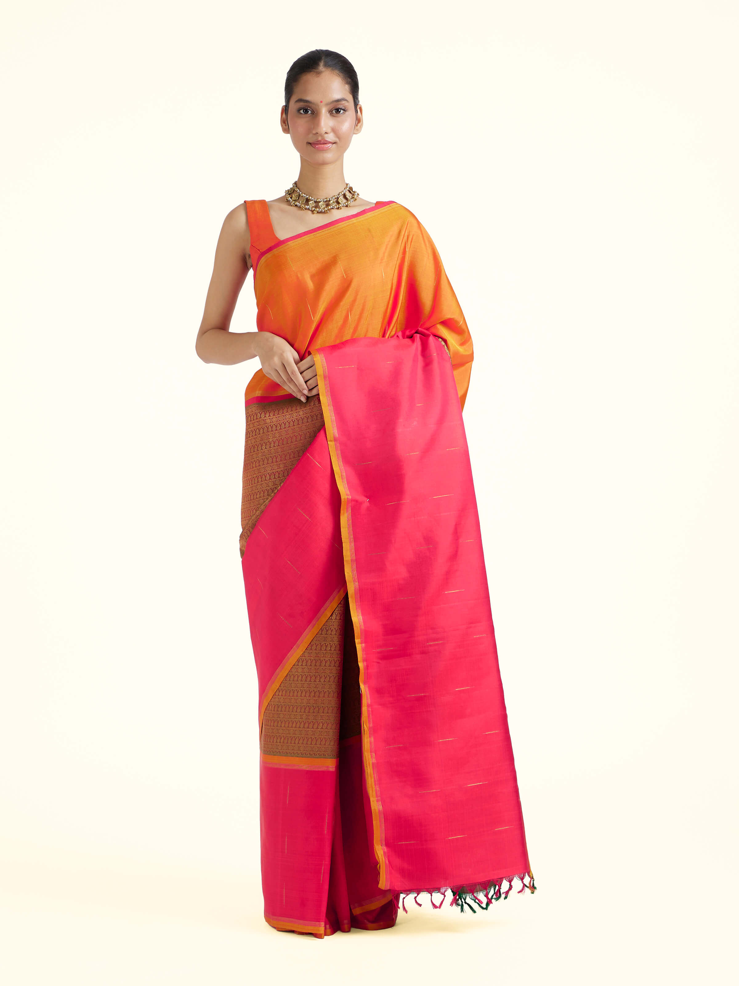 Front view of red silk Kancheepuram saree with rich zari border