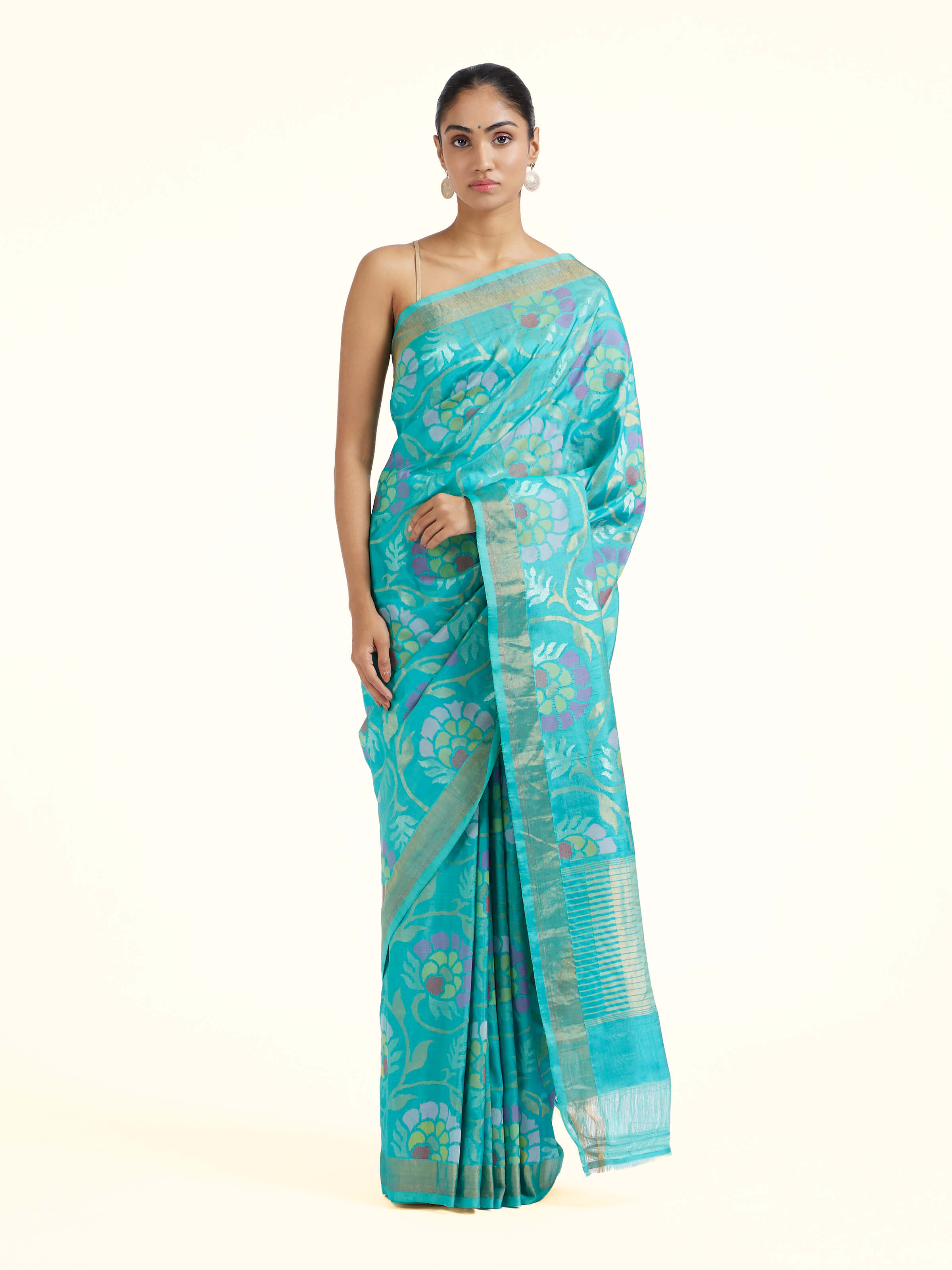 Front view of turquoise mulberry silk Uppada Jamdani saree with delicate woven motifs