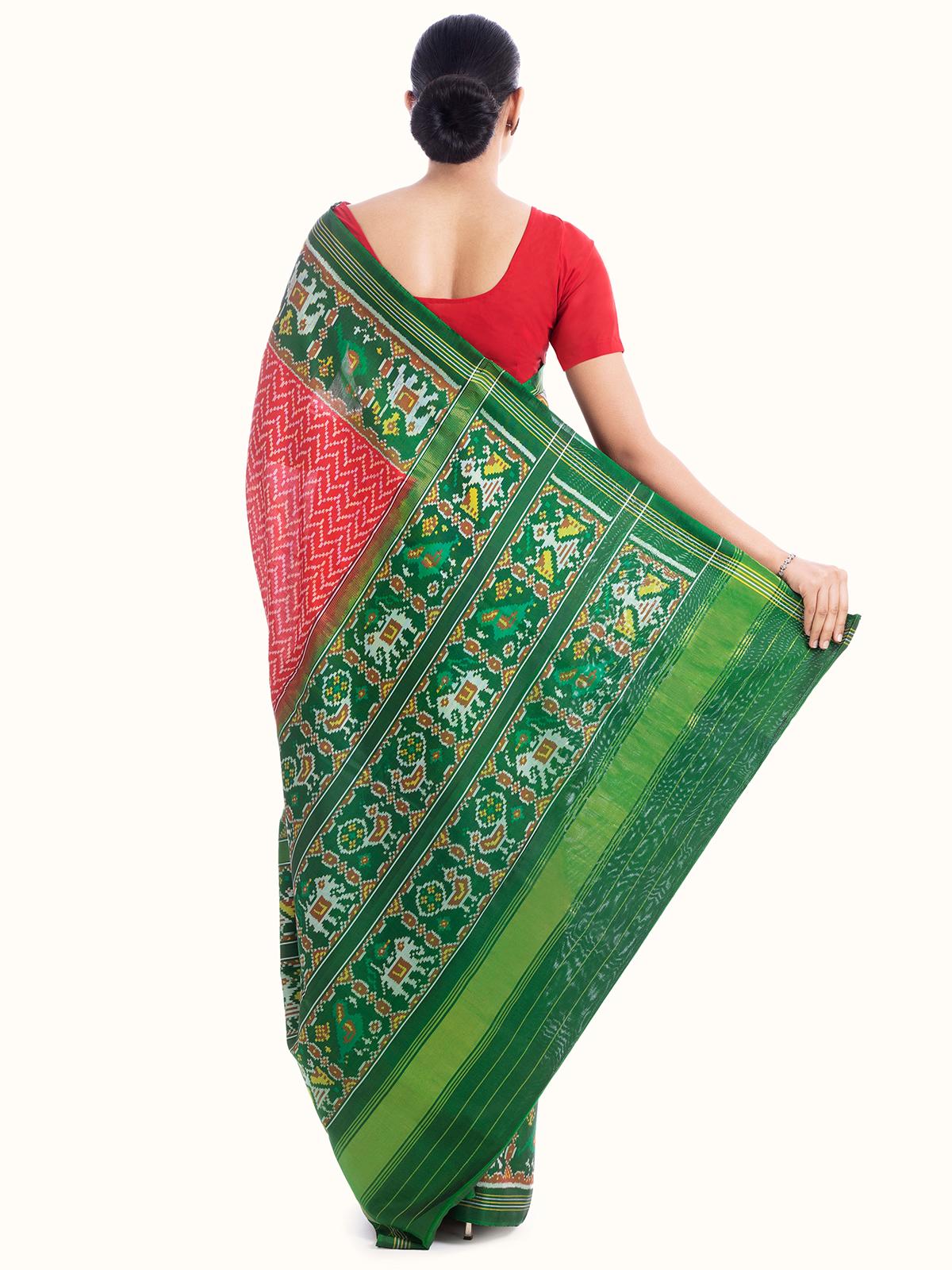 Back view of red silk patola saree emphasizing overall design and fabric flow